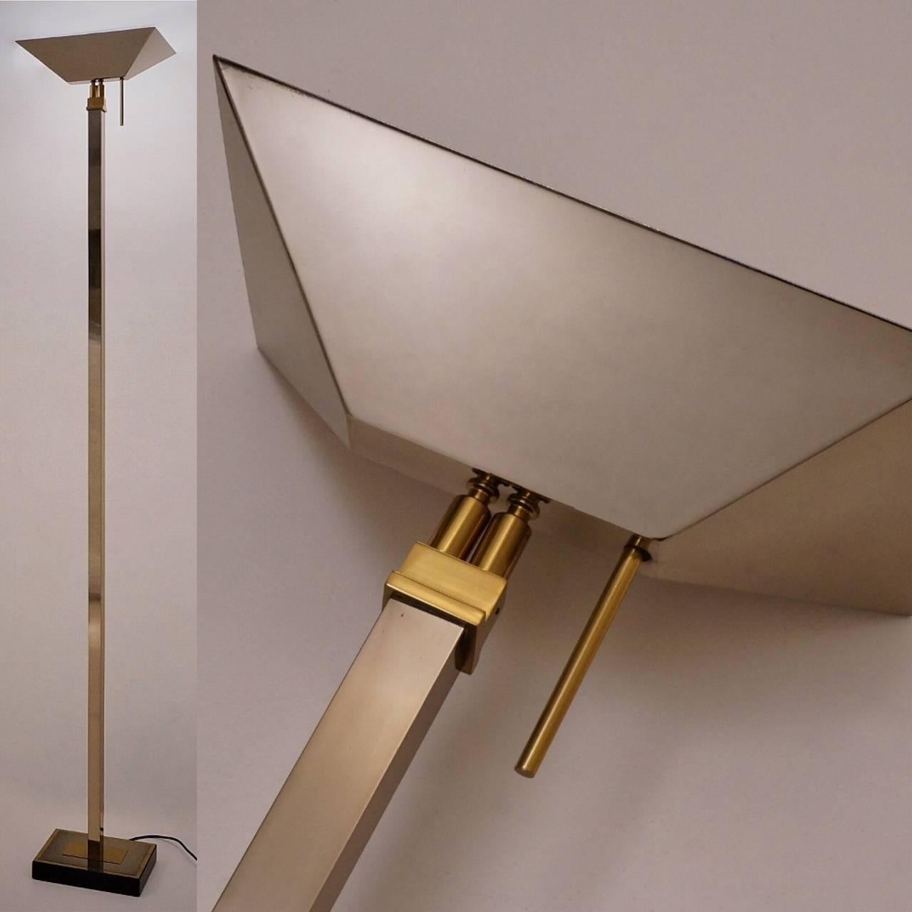 Chrome & brass floor lamp with halogen uplighter by Deknudt Lighting, circa 1970s, Belgian.

This vintage floor lamp has been gently cleaned while respecting the antique patina. It is rewired, earthed & ready to use. This lamp is compatible with