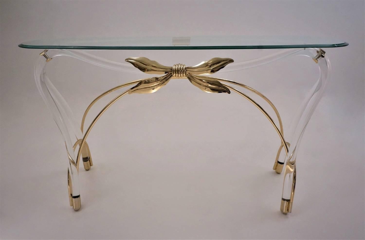 Jeff Messerschmidt console table, Lucite, gold plate gilt and glass, circa 1970s, American.

This console table has been gently cleaned while respecting the vintage patina and is ready to use. The curving glass top with bevelled edge is original