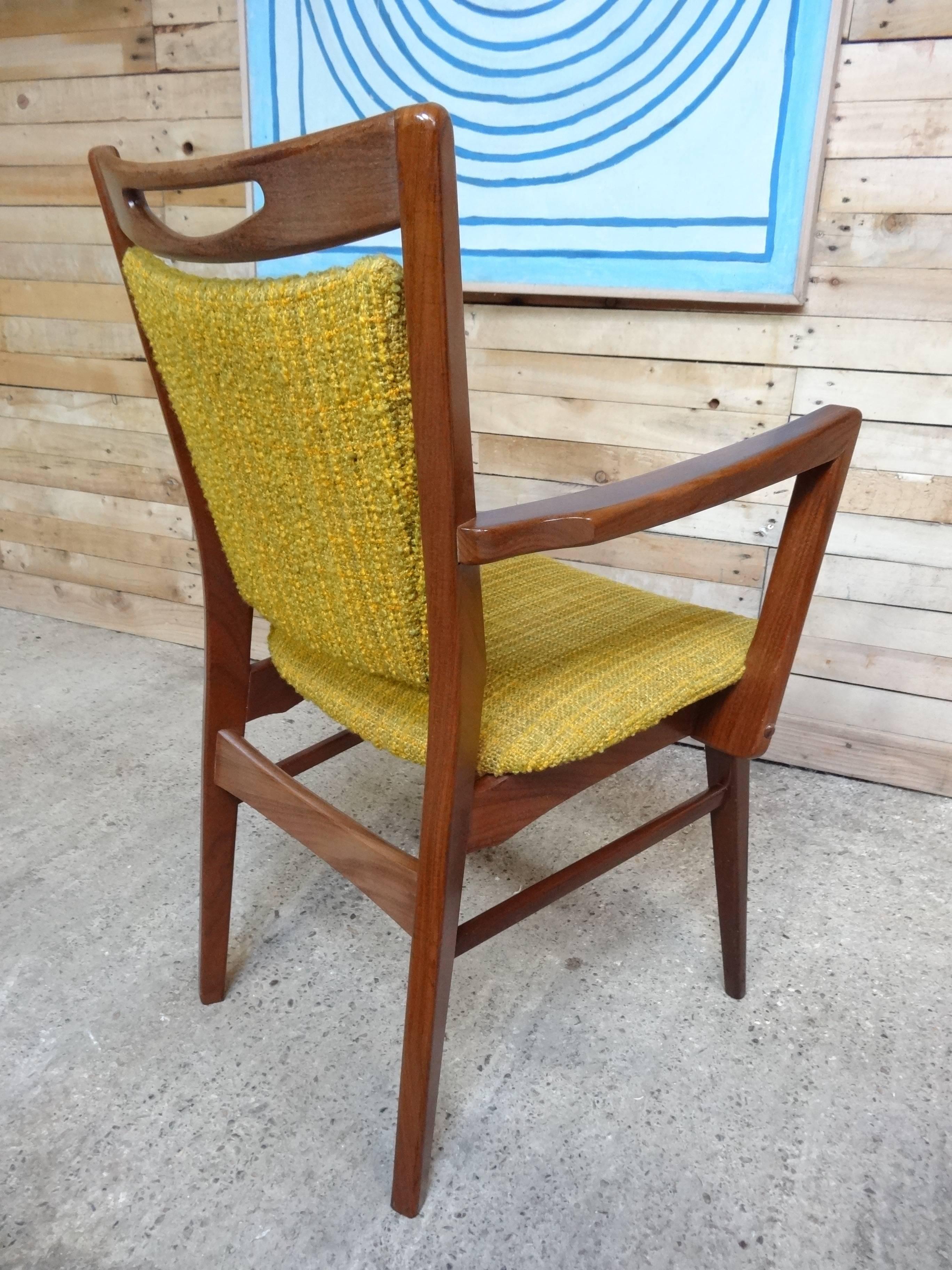 Stunning retro 1950s teak armchair in mint condition.

Chair is in mint vintage condition, it is covered in a super retro yellow fabric which is in mint condition.
Dimensions (approx), seat height 47cm, back 90cm, depth 60cm, width 57cm.