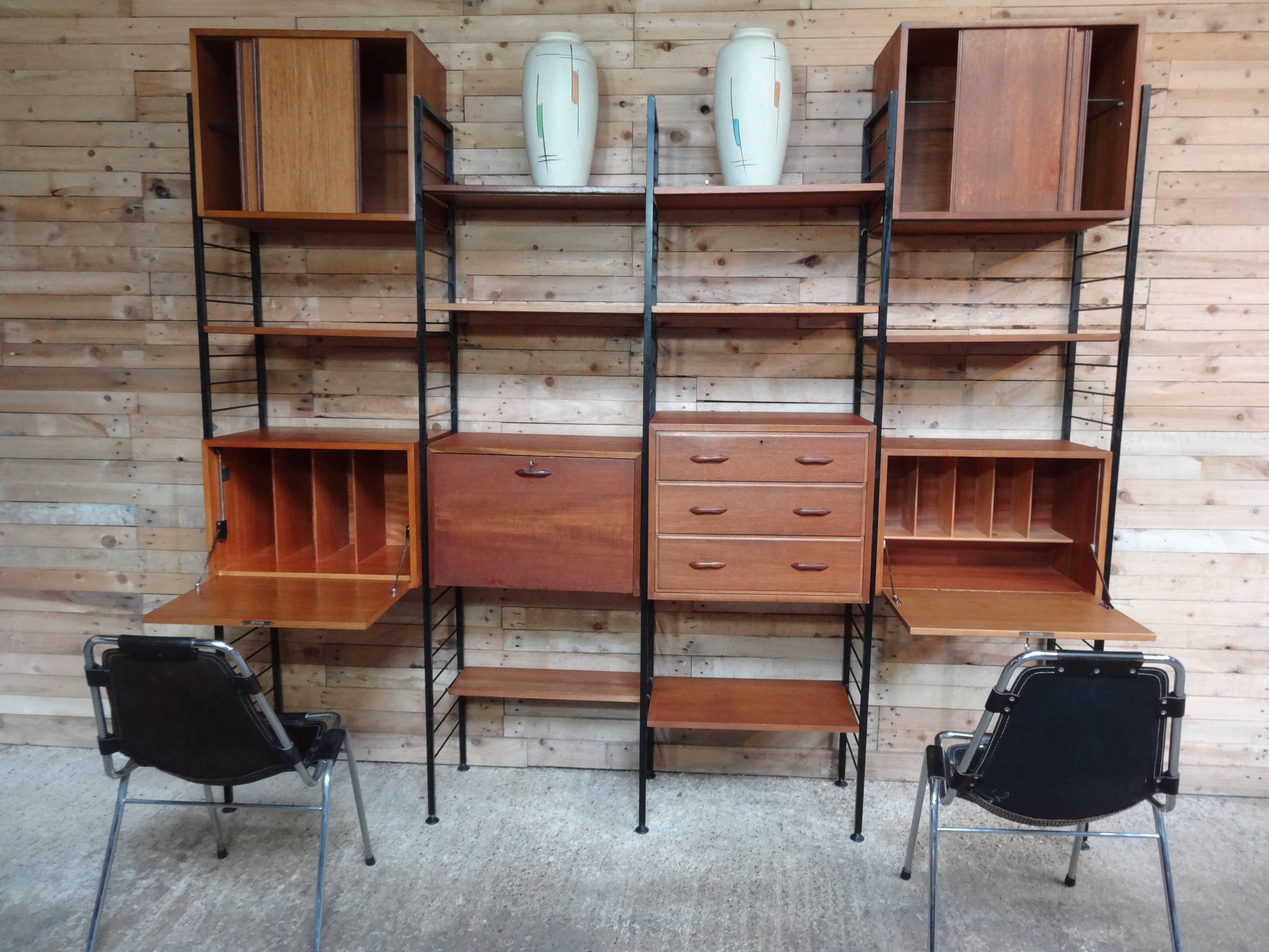 XXL room divider / freestanding black metal framed teak book shelving / storage unit with his and her desk.

Stunning freestanding Ladderax wall system / room divider from the 1960s, it has a two desks and lots and lots of bookshelves and