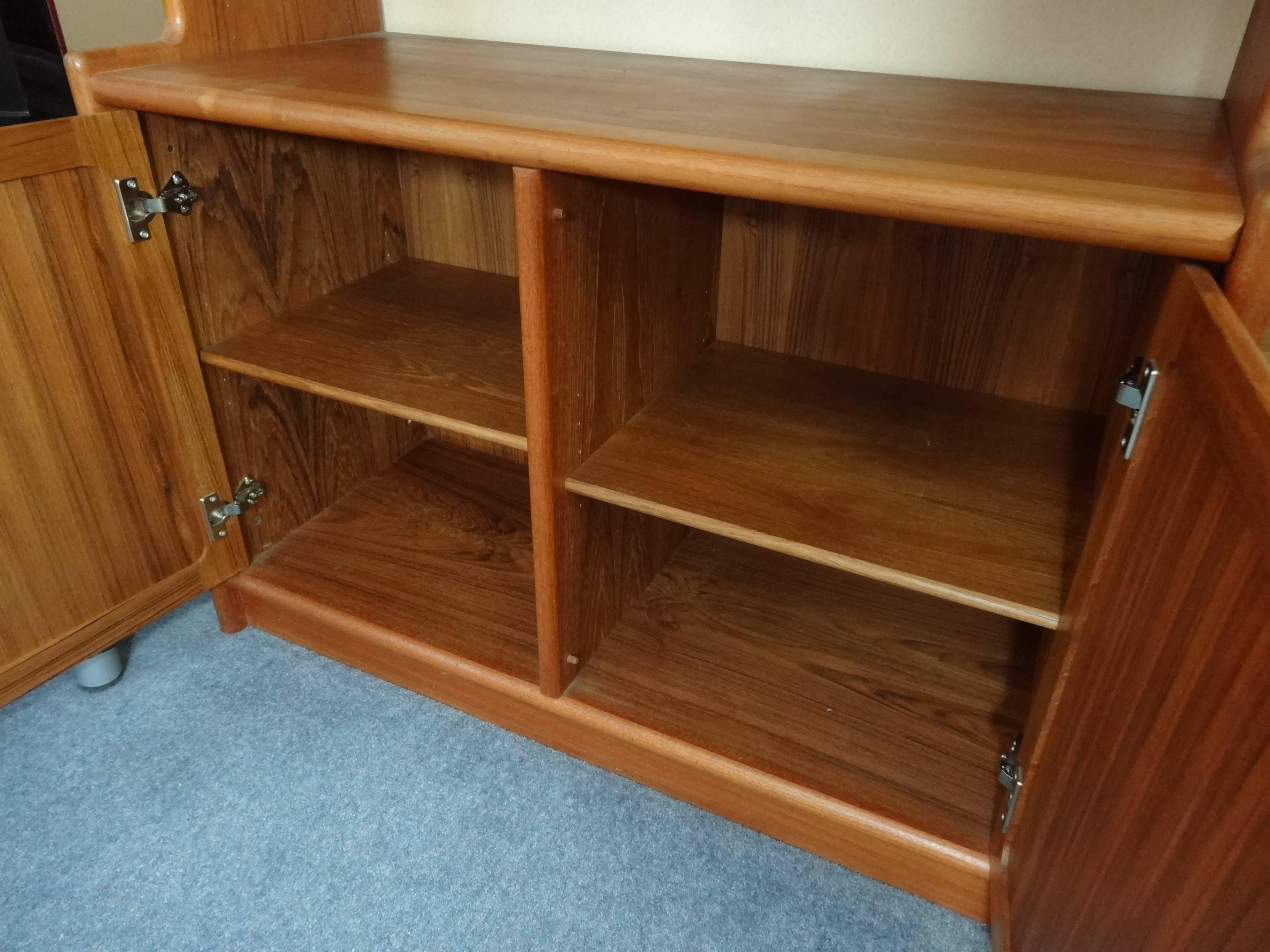 Vintage original Danish XXXL Dyrlund teak wall unit with lots of storage space and shelves, unit is in great condition, no scratches or stains!

Measures: Height 228 cm, depth 48 cm, width 261 cm.