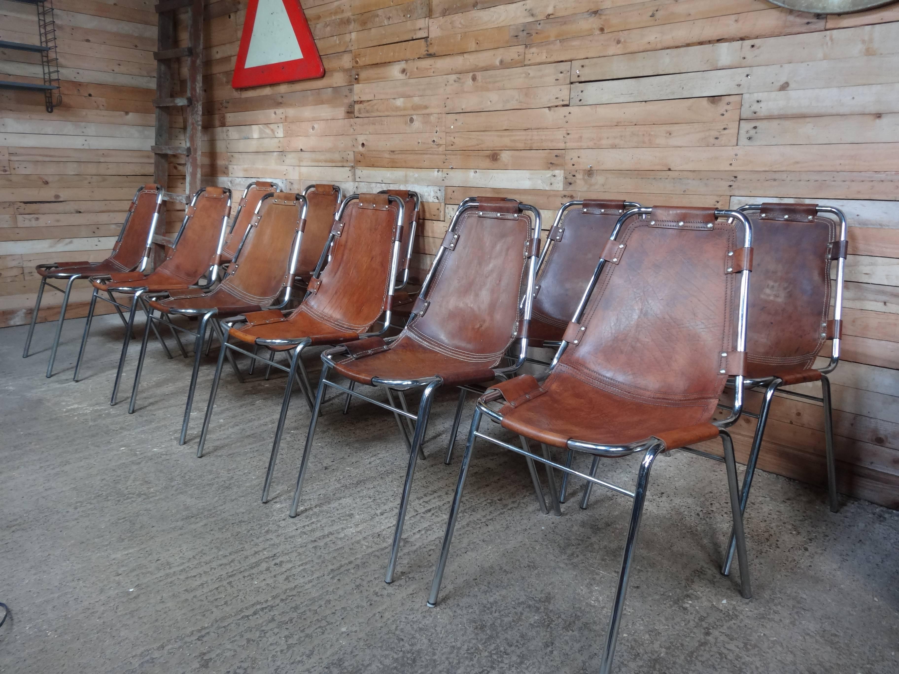 Stunning set of 12 chairs, difficult to find a set of chairs like this on any web site worldwide! designed / chosen by Charlotte Perriand for and used in the Ski Resort Les Arcs, circa 1960. 

These chairs have been chosen by us on their lovely