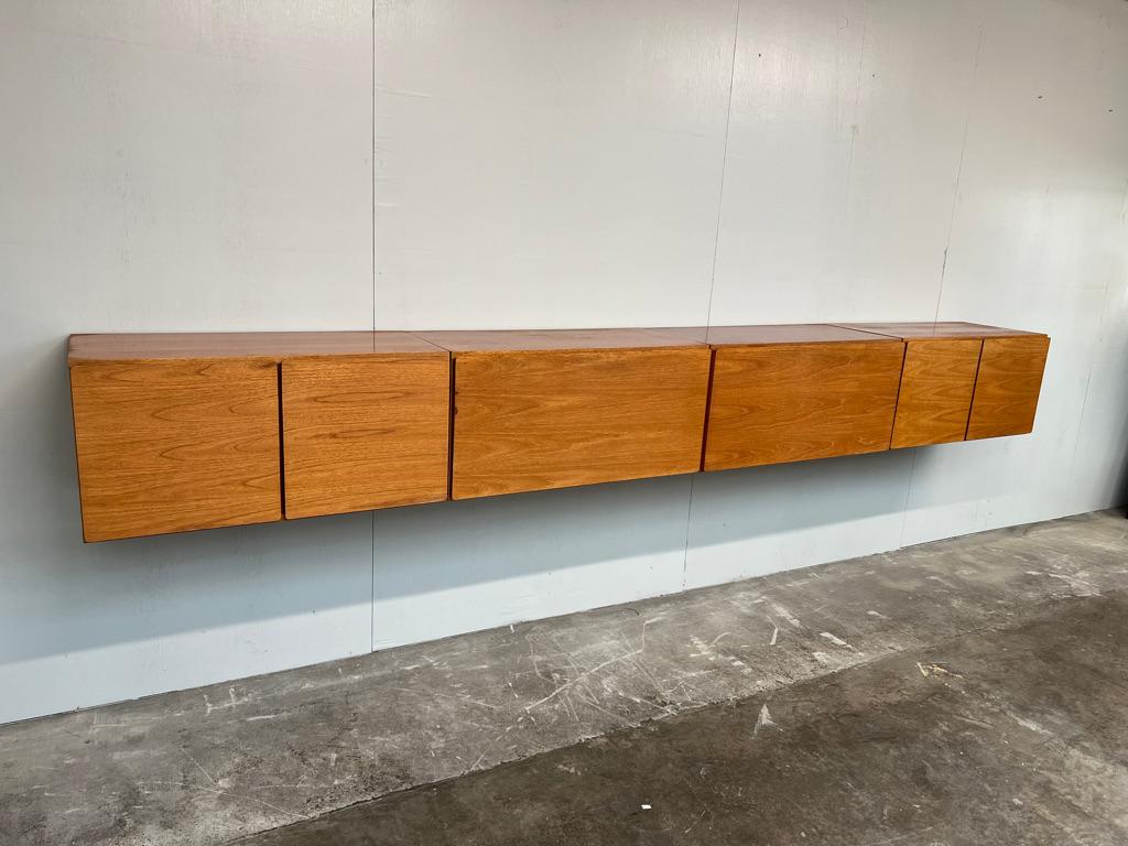 Sought after totally free-hanging extra large sideboard, super minimalistic. Height can be adjusted as required, it is very easy to fix to the wall (with metal or wooden wall brackets which are all included!). This set comes in four parts, each