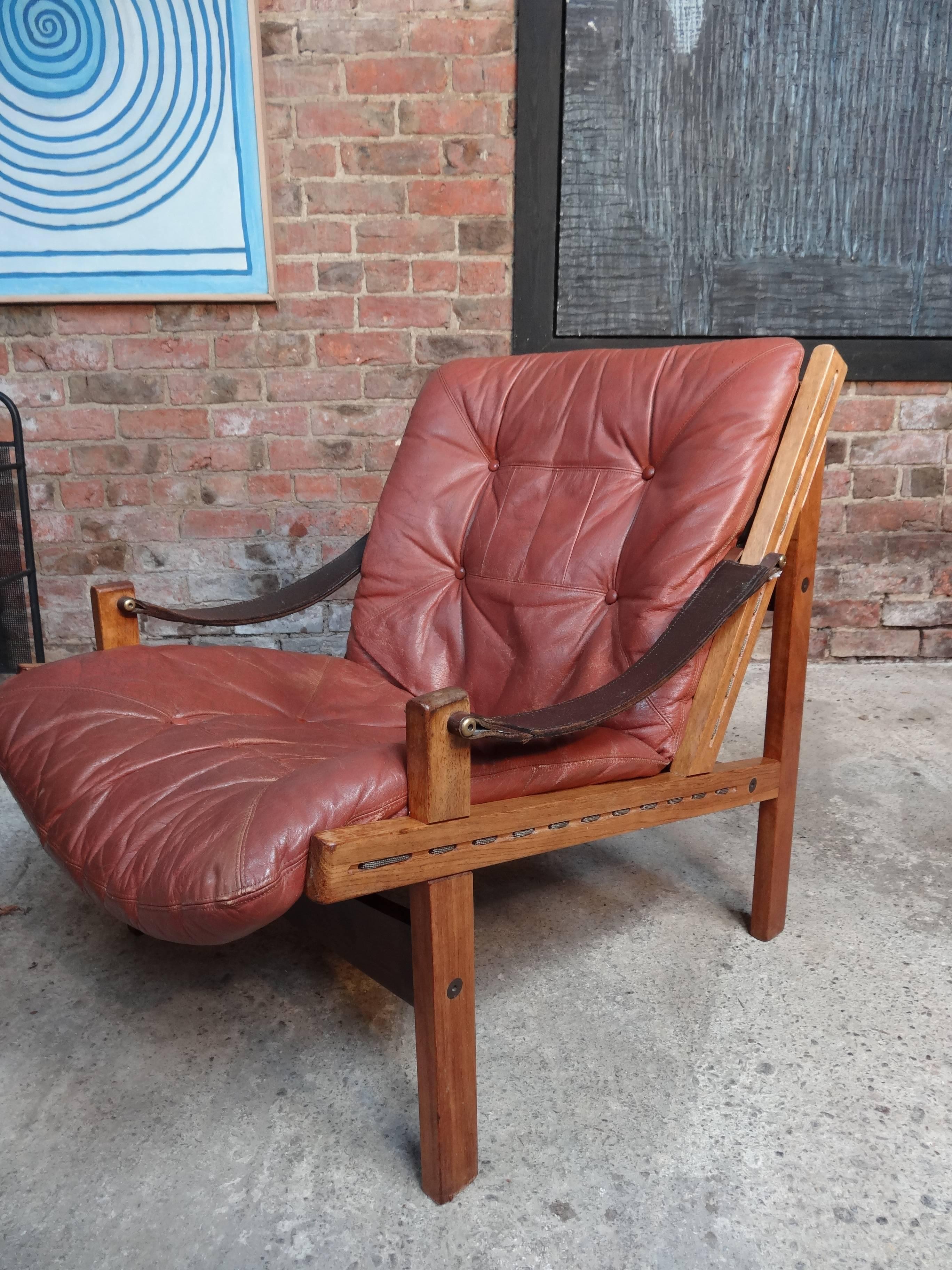 brown leather sling chair