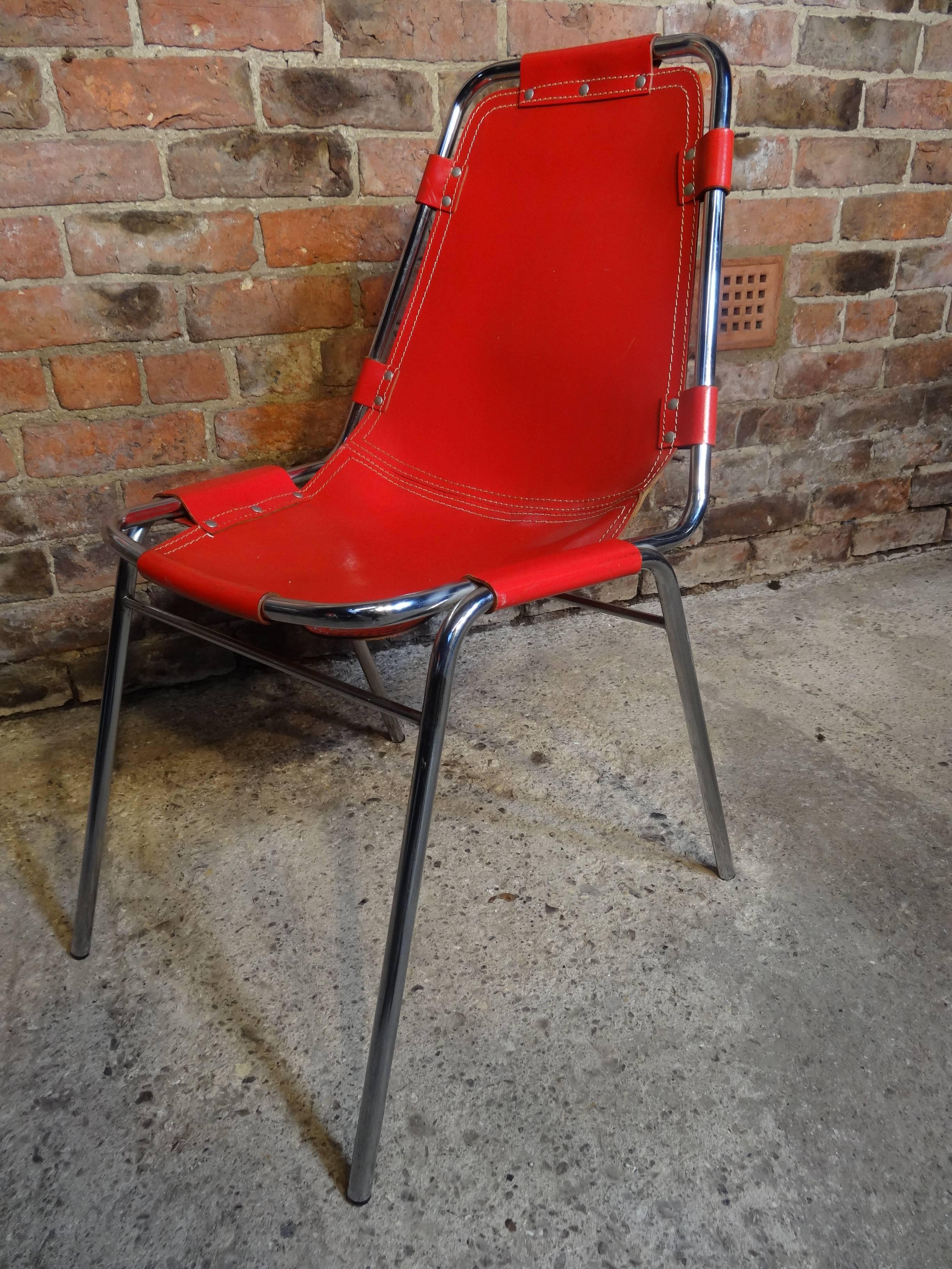 Stunning chair very unusual and sought after, selected for and used by Charlotte Perriand in the Ski Resort Les Arcs, Very nice chrome tubular frame with thick red leather seat. 
Measures:
Height: 82 cm, seat height: 44 cm, depth: 60 cm, width: 48