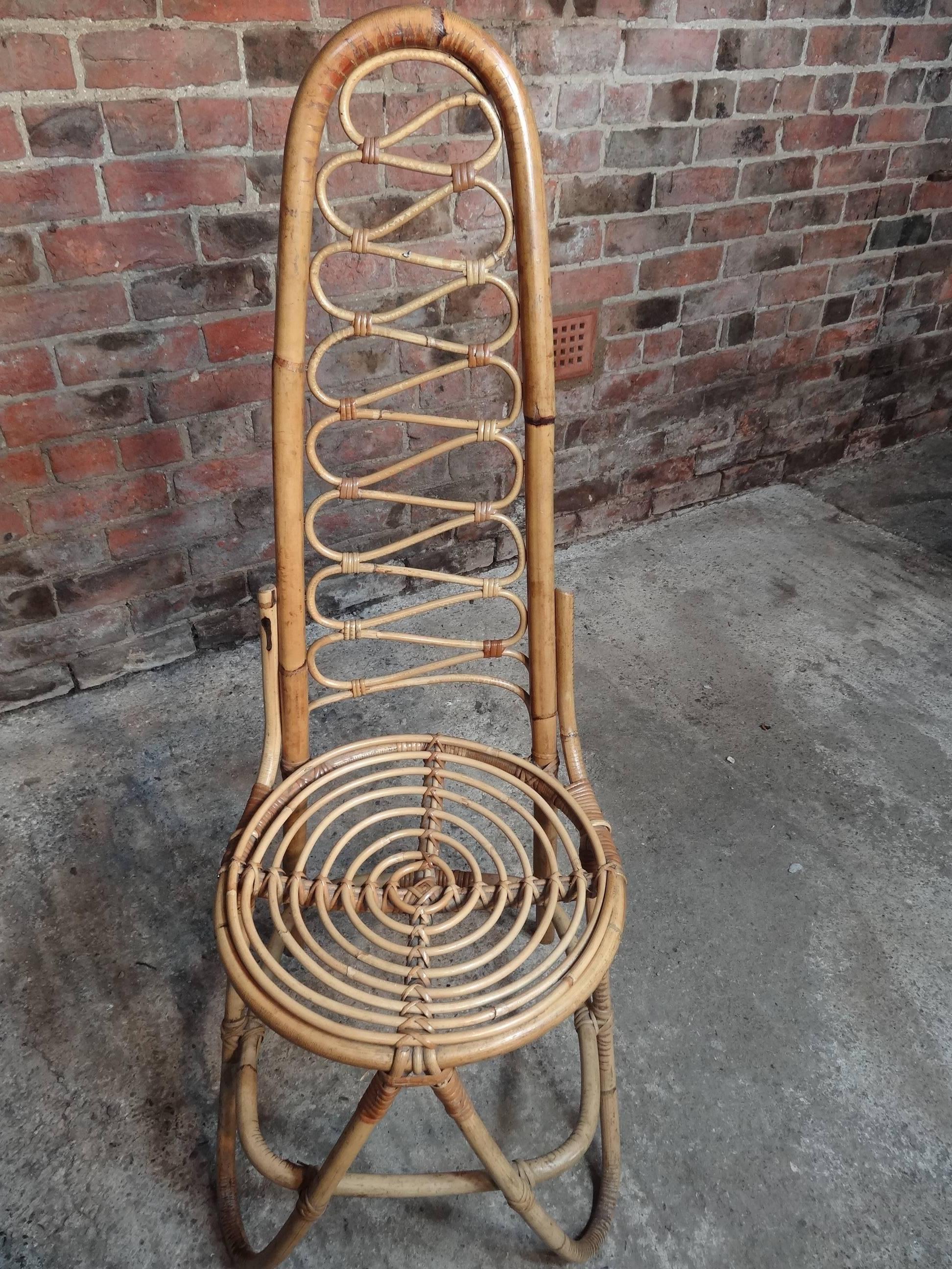 Stunning cane / bamboo designer chair, which is in very good vintage condition. 

 Measures: Seat height 45cm, height 116cm, depth 50cm, width 44cm.