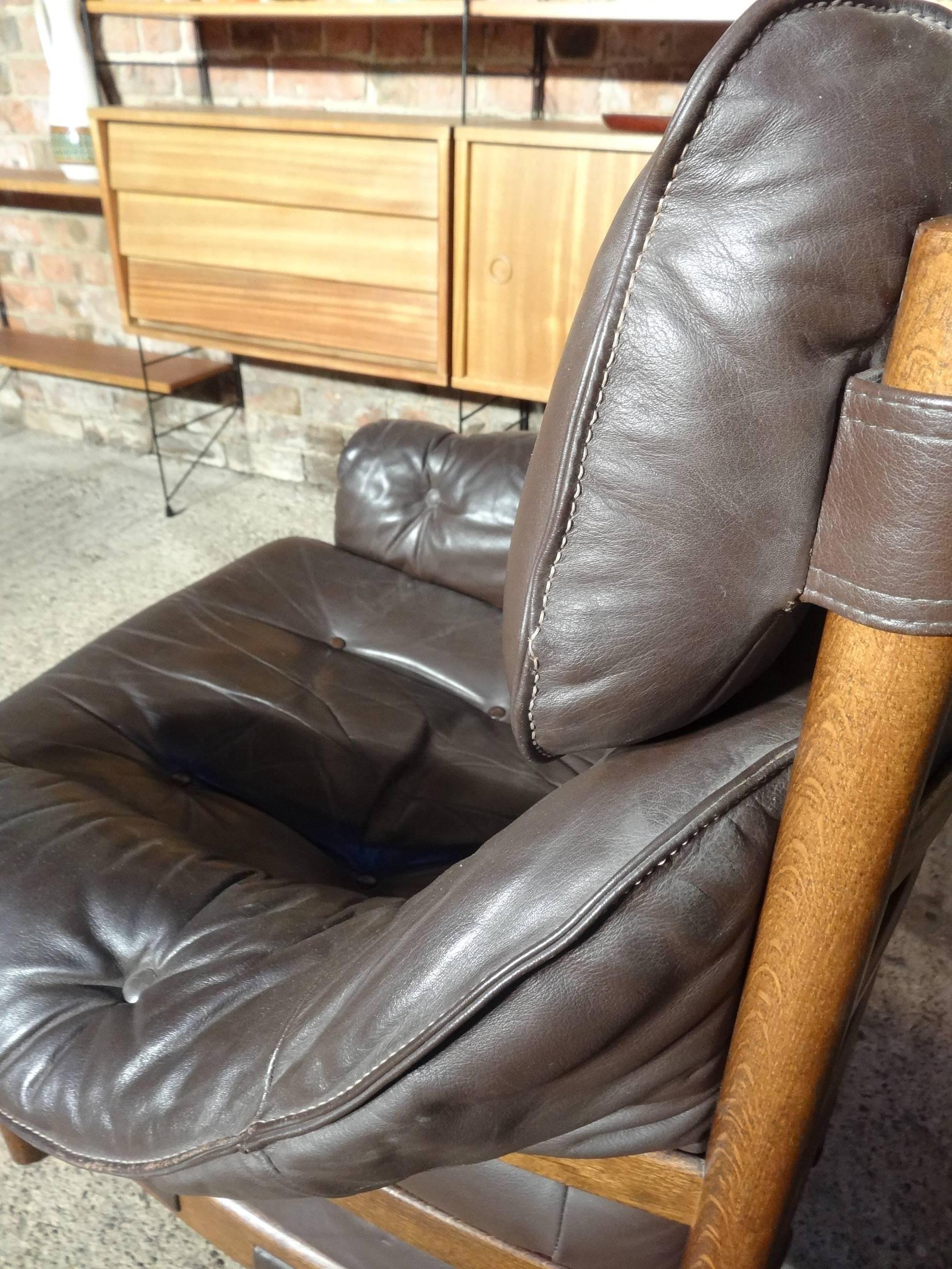 Great Arne Norell brown leather chair in mint condition, leather is mint condition, this Classic Danish sofa are the antiques of the future and look great in any decor.

Measures: Seat height: 45cm, height: 70cm, depth: 88cm, width: 85cm.
