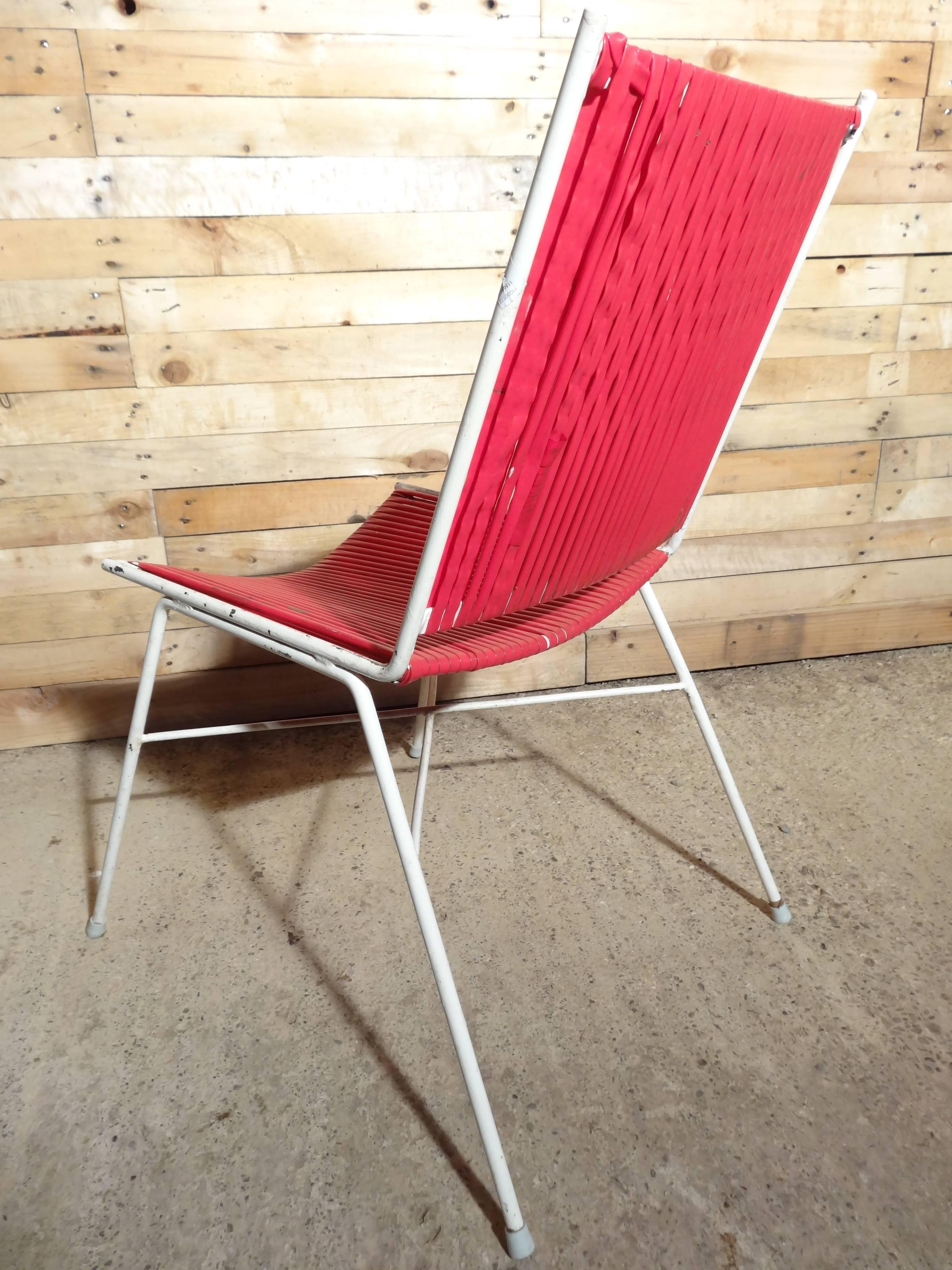 Pair of French red and blue wire chairs. 

Measures: Seat height: 44cm, height: 82cm, depth: 55cm, width: 52cm.