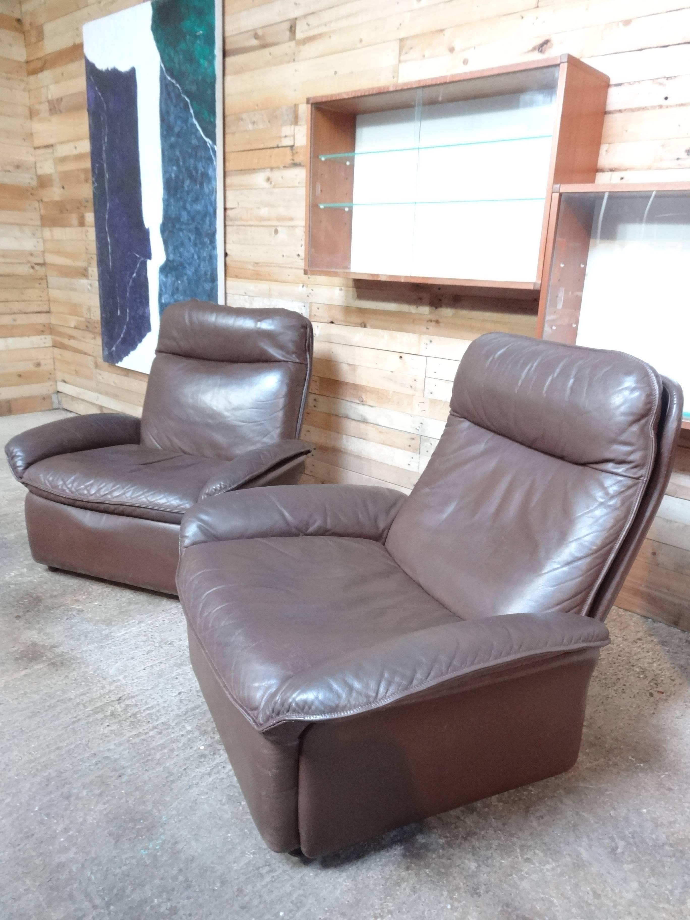 Super unusual set of stylish cognac coloured armchairs made by De Sede furniture makers, lovely organic shape, leather has lovely patina, the set is in good vintage condition. Price is per chair, we currently have two chairs available, please