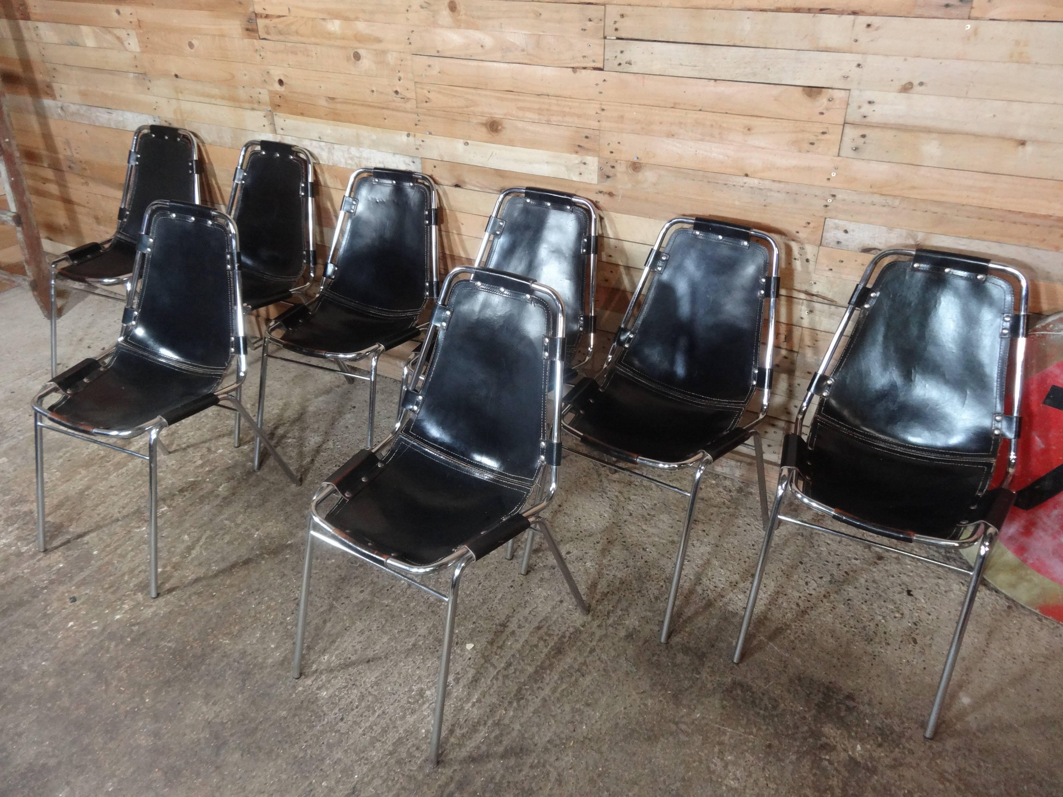 Only set of eight black leather Charlotte Perriand chairs! Chosen by Charlotte Perriand for and used in the Ski Resort Les Arcs, circa 1960. These chairs were commissioned to be made by DalVera. Very nice chrome tubular frame with thick brown