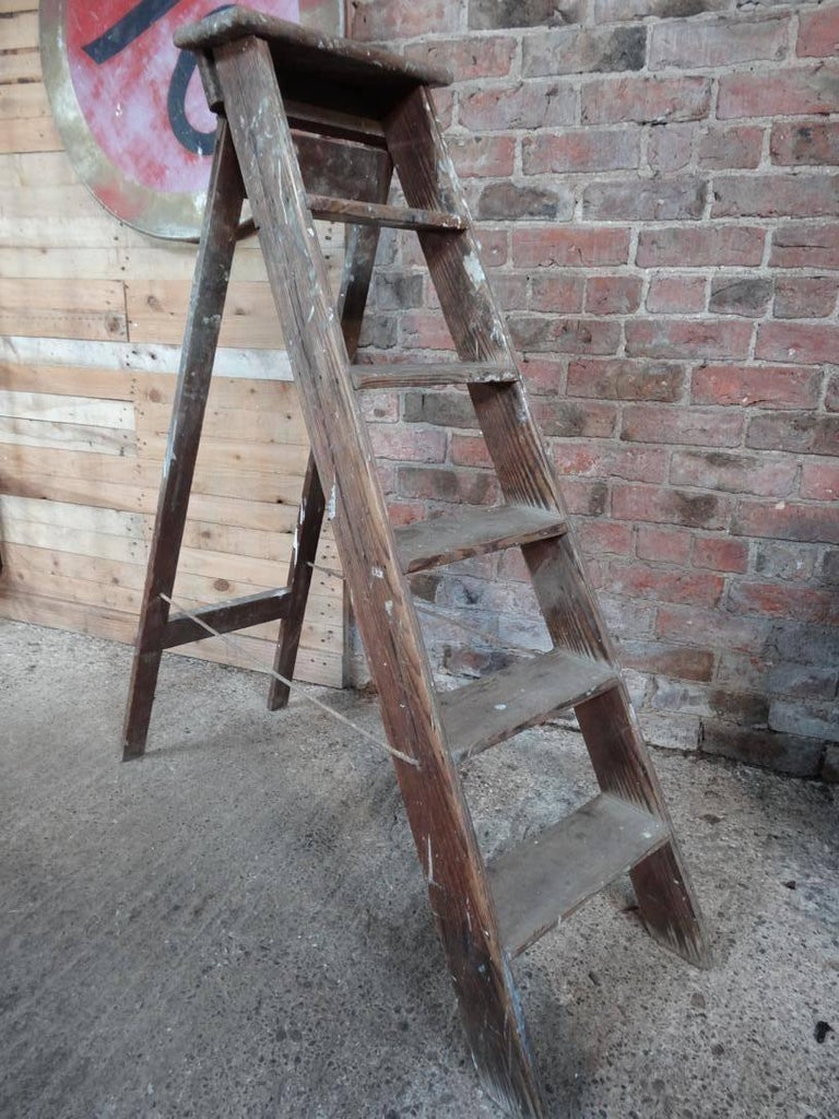 1900s French vintage fruit picking / painting ladder. 
This ladder will be great as an vintage library ladder
It is sturdy and usable.

We currently have a couple of these ladders for sale. 

Measures: Height 131cm, depth 110cm, width 41cm.