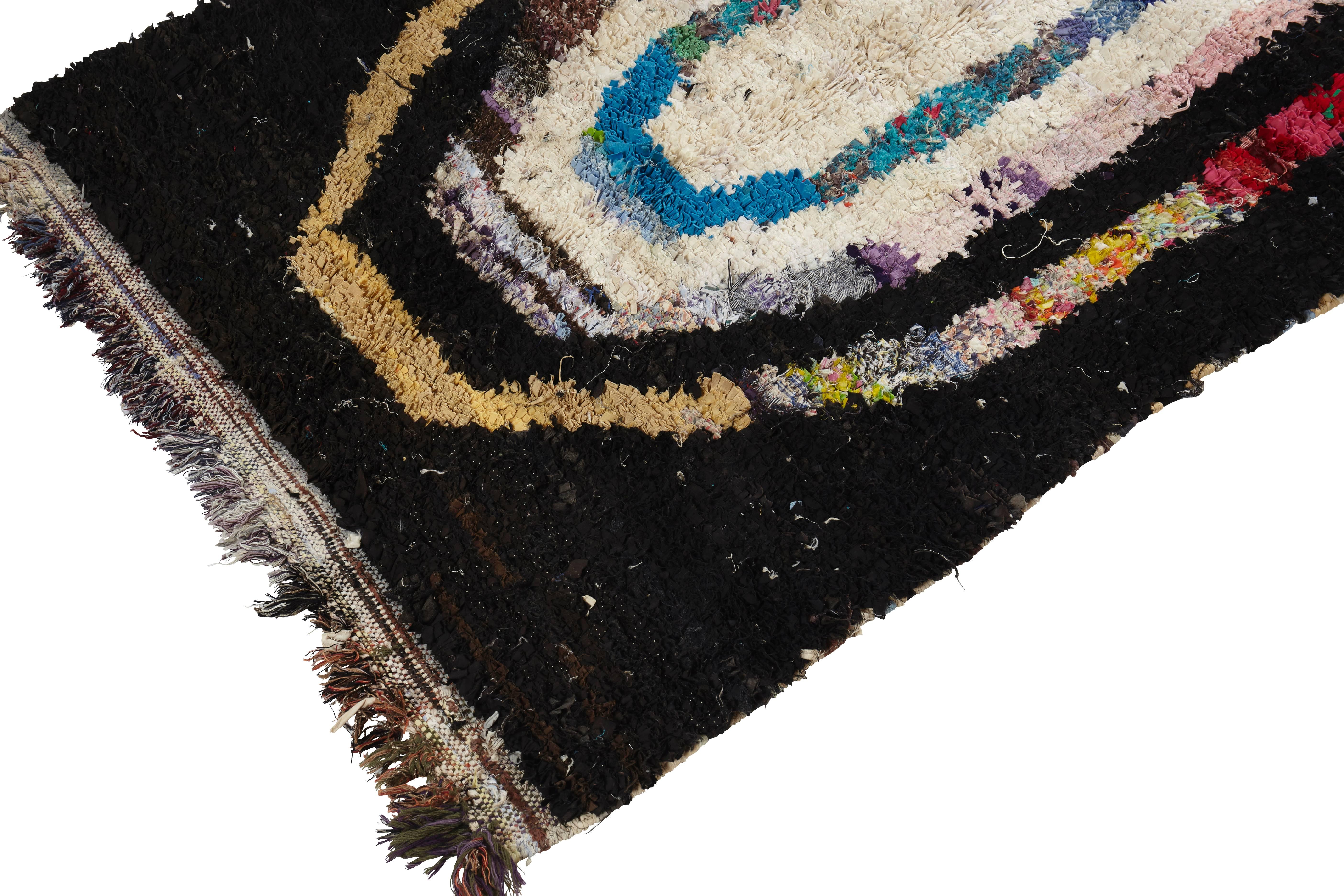 Boucherouite rug,
Ourika, Morocco,
late 20th century.
Synthetic fibres, rag rug.
Extremely rare motif.

Measures: 160 x 70cm.

This Boucherouite rug from the Ourika area of Morocco has been hand woven with found fabrics and rag to create