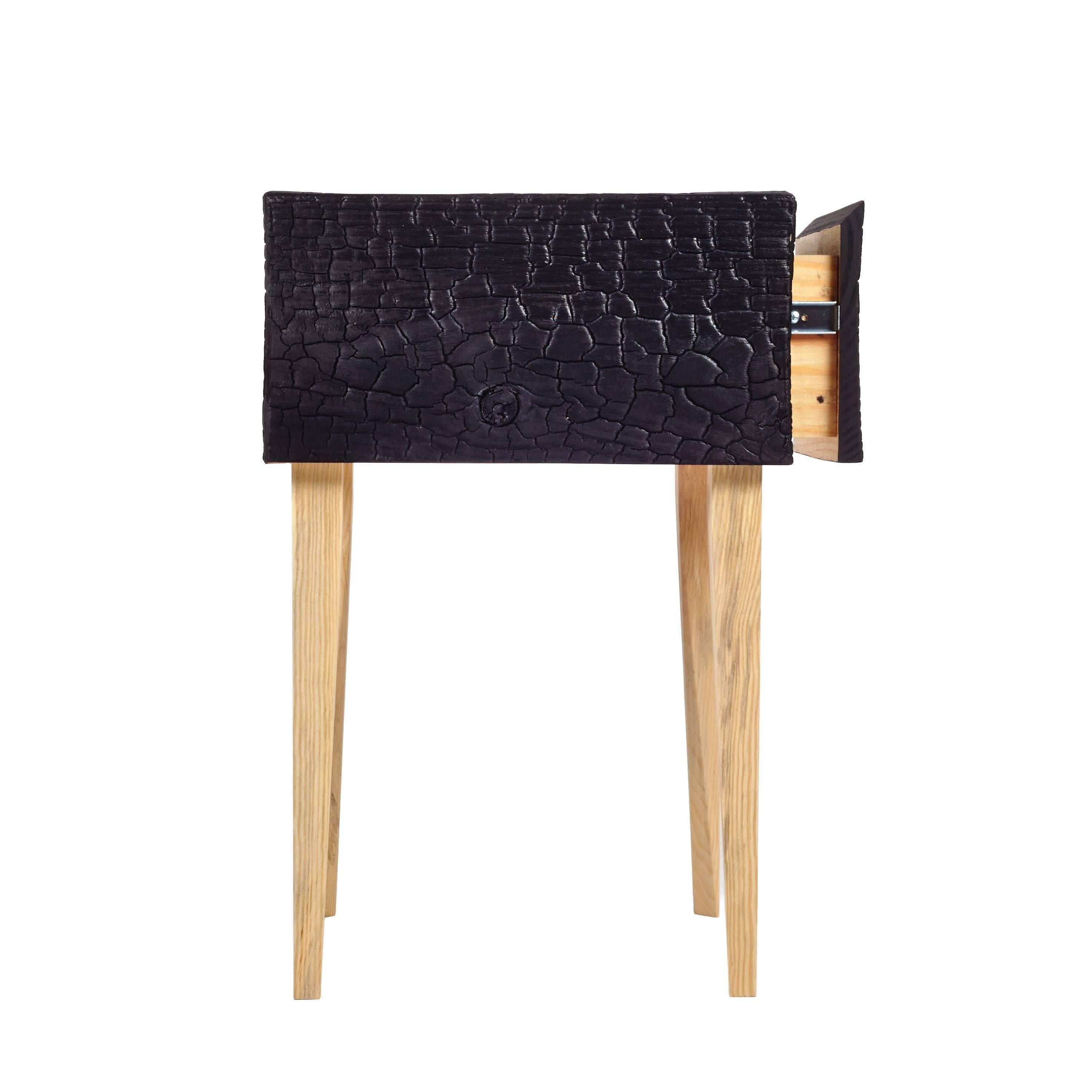Charred Geometric Commode, Edition of 25. Here our single drawer modern interpretation of the traditional bedroom mainstay is rendered in charred Loblolly Pine; with mitered edges, the undulating texture wraps the case in deep color. As a counter