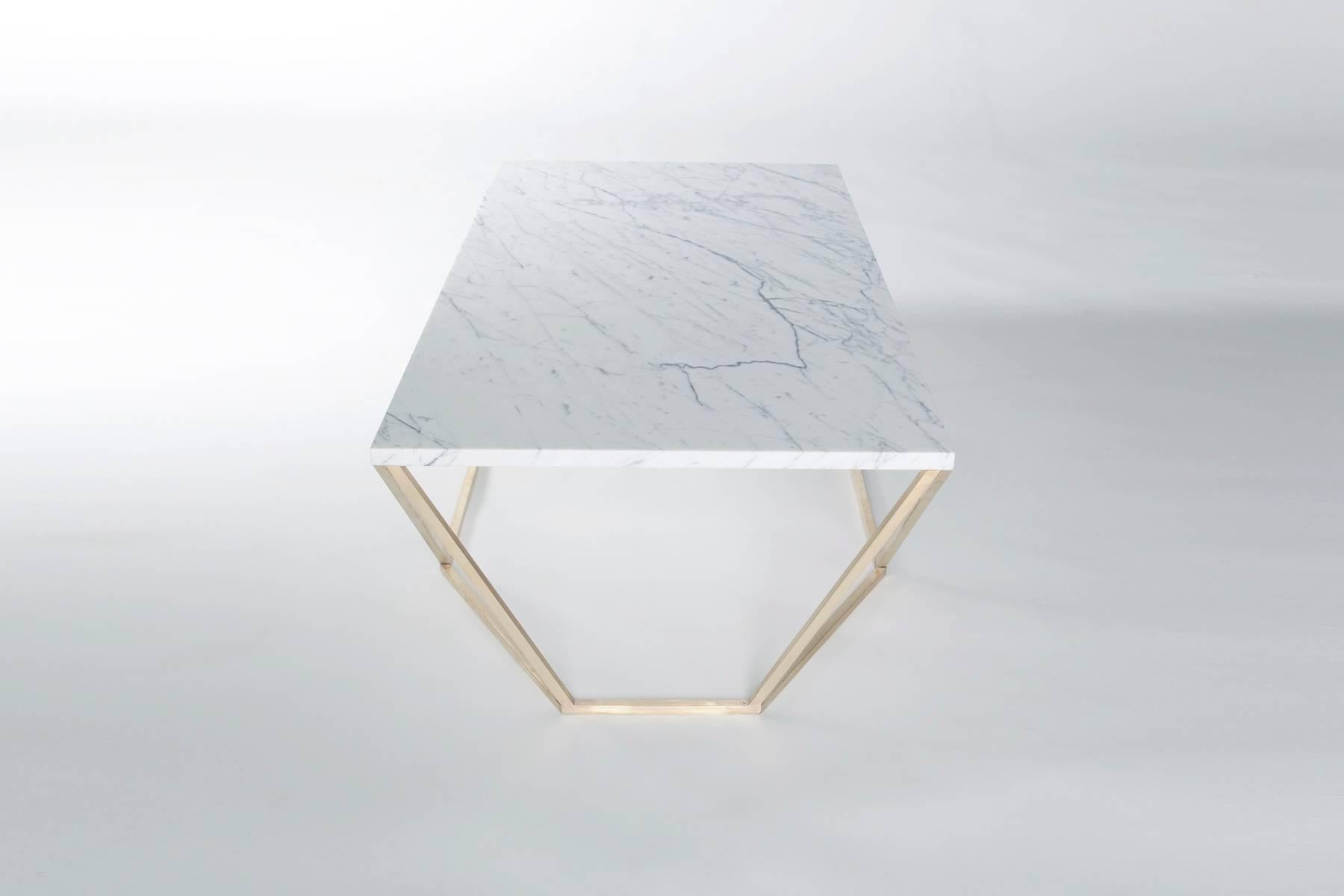 The newest finish combination for the Dusk coffee table features a geometric solid brushed-brass base with a white Veneto marble tabletop.

The octagon-meets-rectangle shape transforms when viewed from different angles. The Dusk coffee table was