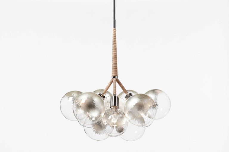 Ethereal and iconic, the bubble chandelier is a modern re-interpretation of the crystal chandelier. Its luminous constellation of delicate glass globes adds beauty and depth to any interior environment.

Based on an original design first conceived