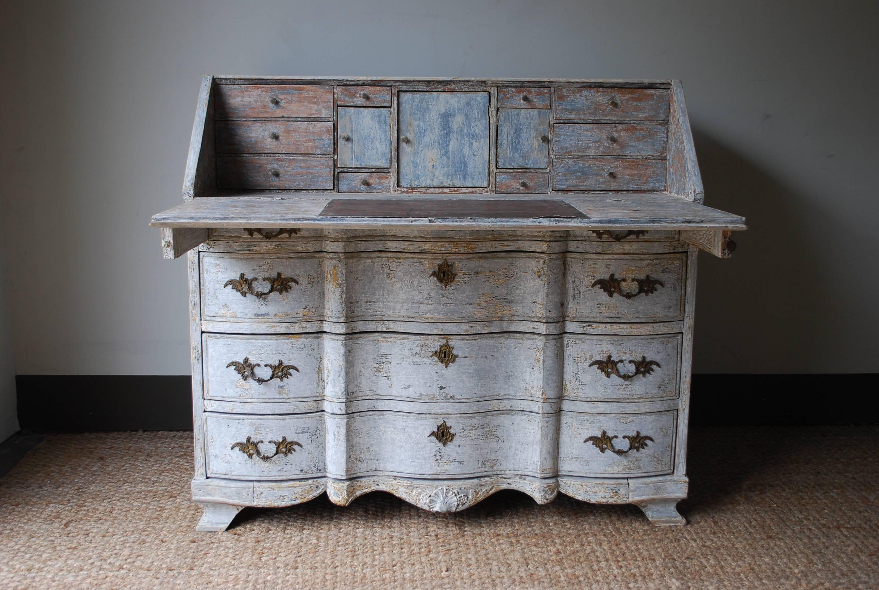 Swedish Gustavian beautifully shaped block front desk. Light blue paint has had some touch up. The interior drawers are original in color. Ormolu pulls add decoration to this distinct piece, circa 1760.