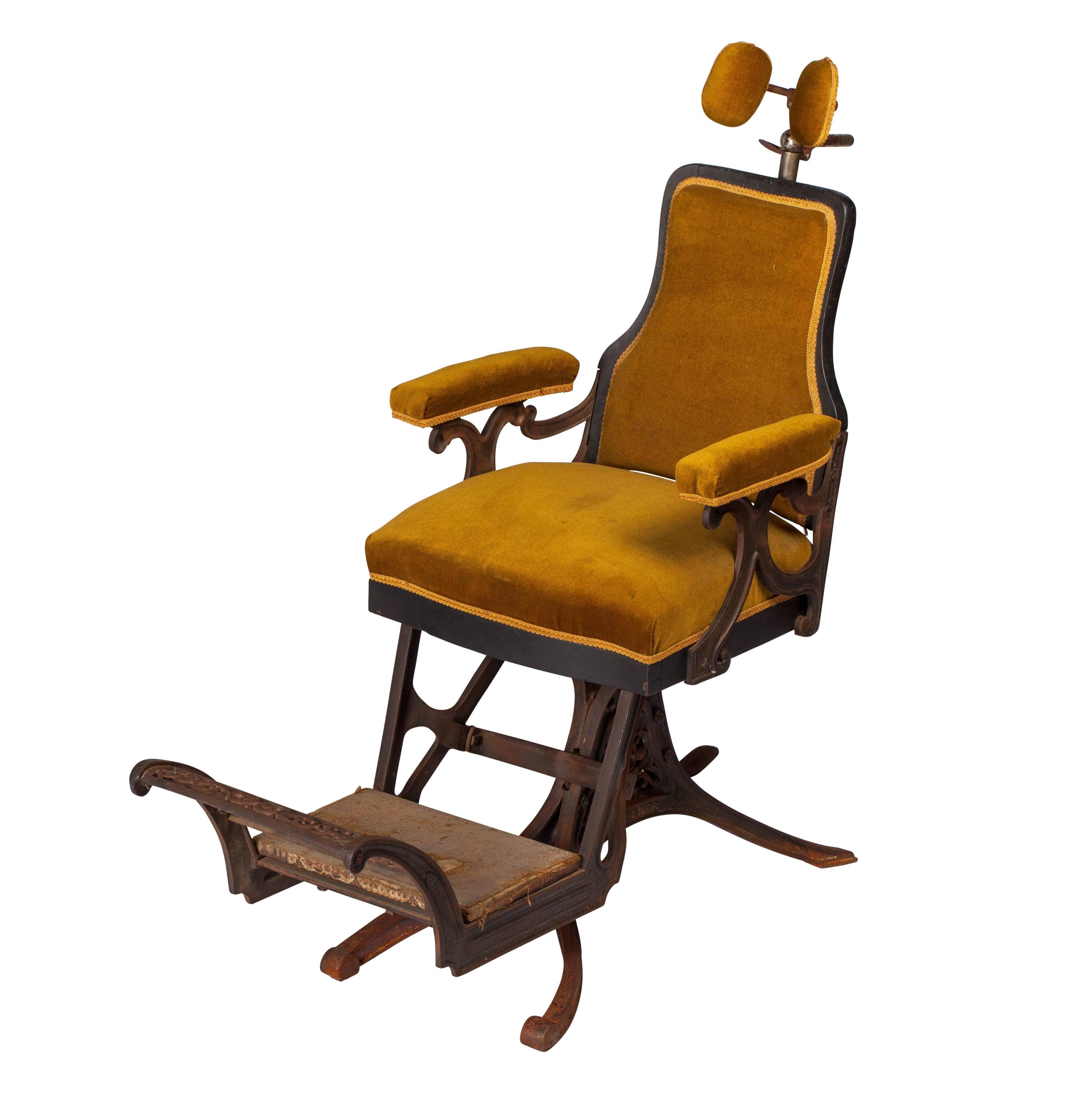 Impressive dentist chair, late 19th century cast iron with seat and headrest in velvet. It is adjustable and can be tilted. This model was manufactured by Louis Alexandre Billard, 1890. The back is covered with leather.