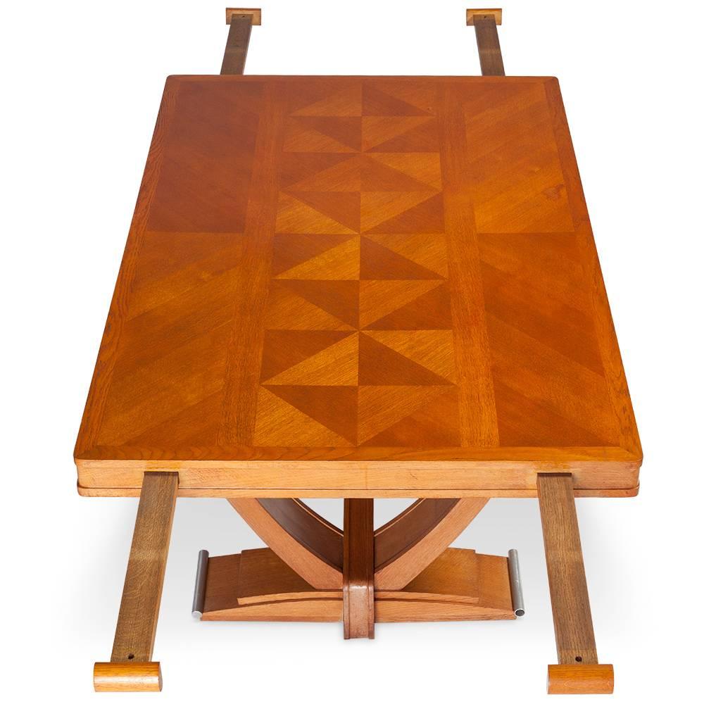 Beautiful table made by Gaston Poisson. The table can be extended (missing leaves). This is a beautiful work made in France, circa 1940.

The seats, a cabinet and an amazing credenza from the same collection will be on 1stdibs soon. Ask us for