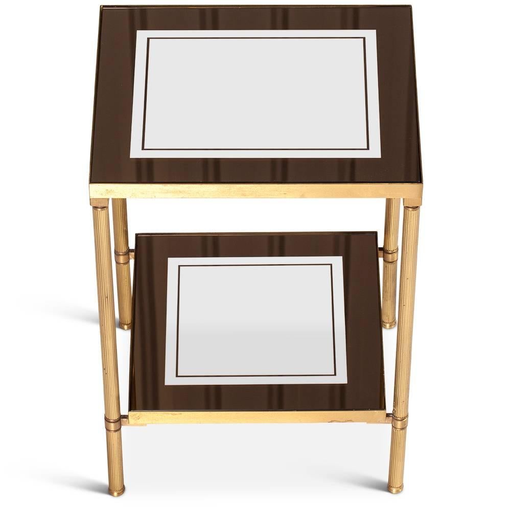 Nice pair of Mid-Century Modern side tables. With two levels. Each glass has a mirror effect on the borders.