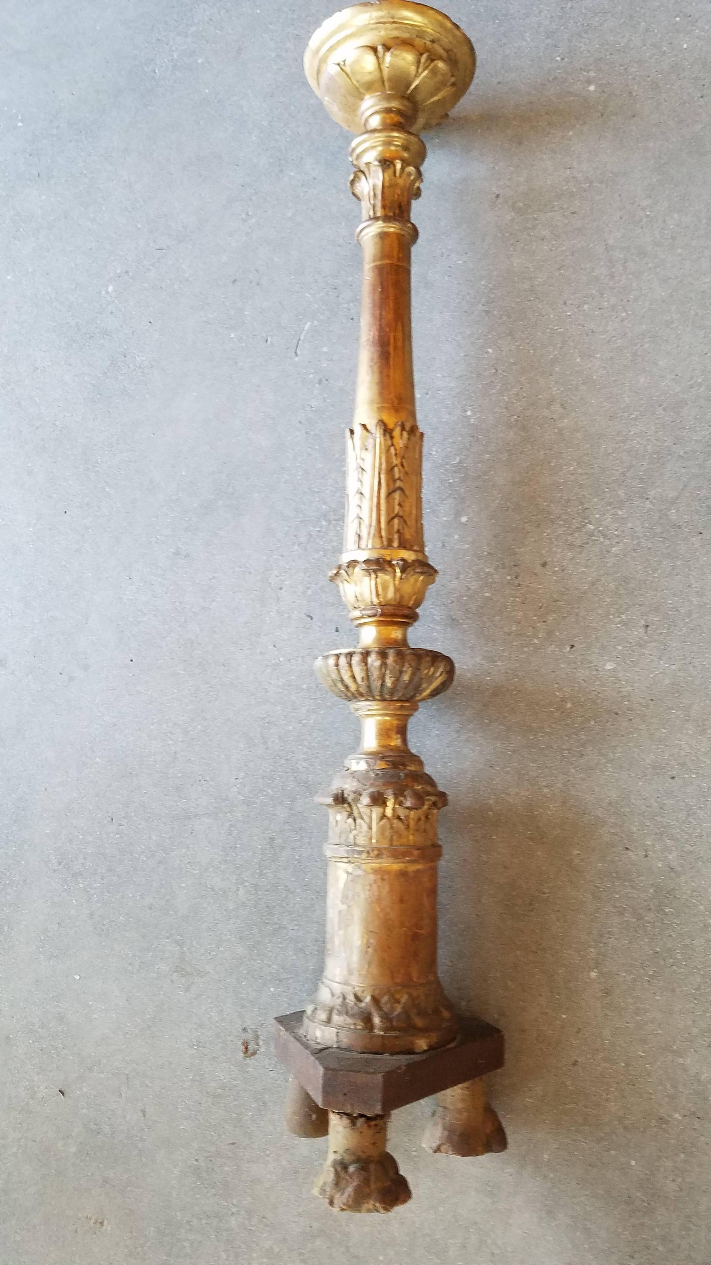 This is a large candle stand from 1820 and has had some lifetime to show with it's replaced back foot and repaired middle yet has all the patina and carvings that provide a statement.