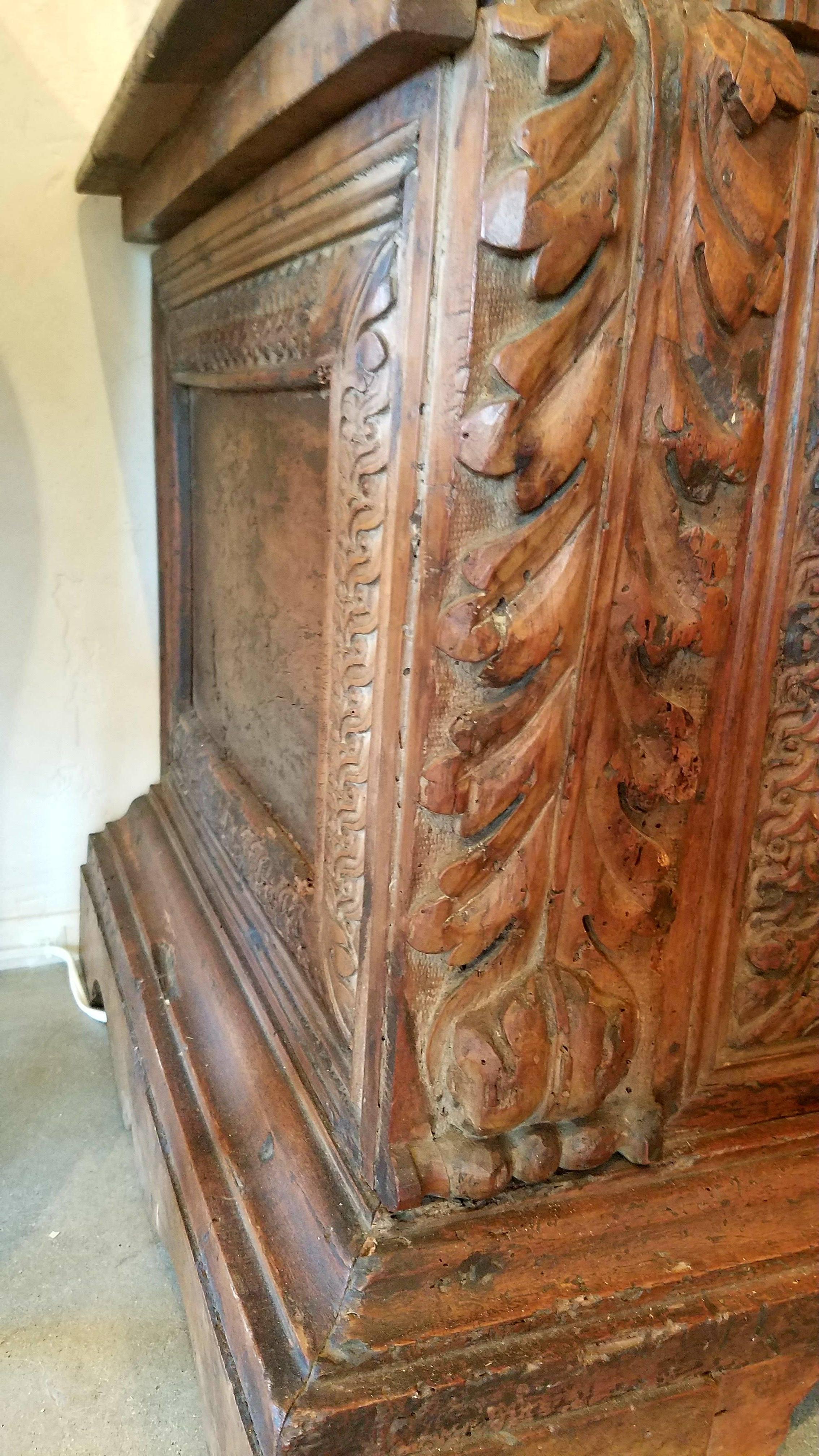 Antique Italian Renaissance carved cassone from the 1600s with center crest, grape and vine design and acanthus detail.  Beautiful patina.