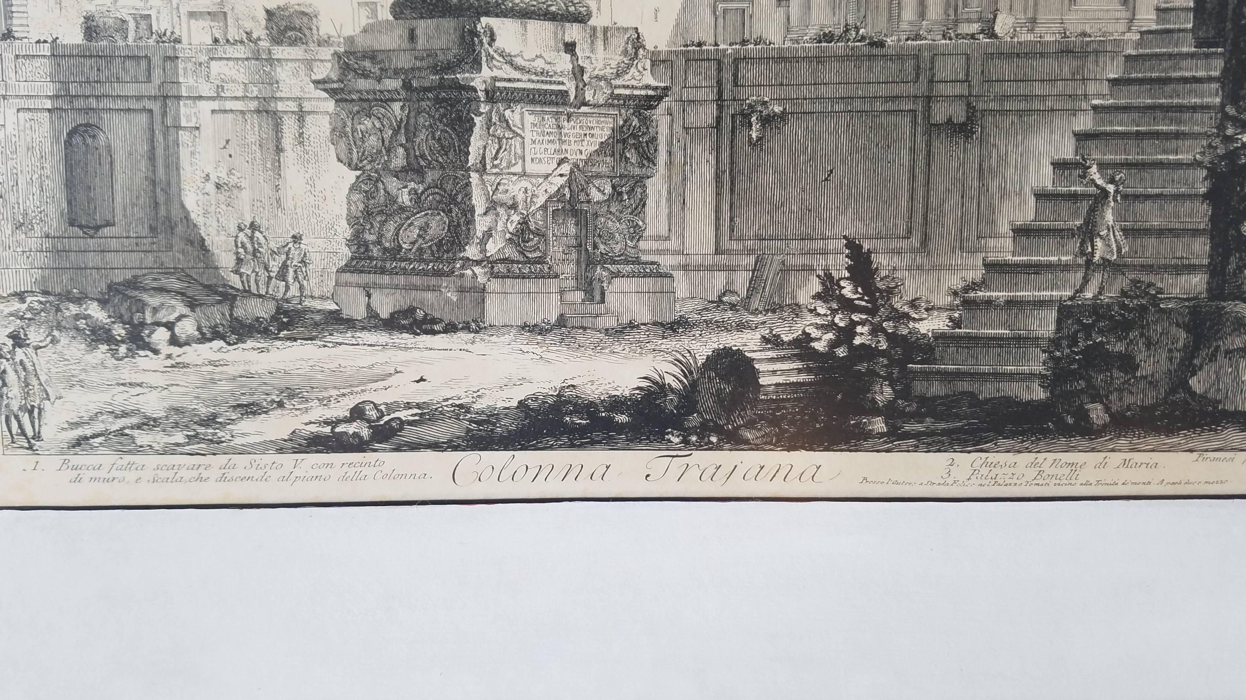 This antique lithograph of Colonna Trajana from Vedute di Roma was originally etched by Piranesi in Italy 1720-1778 framed in white gold frame is backed in a modern metallic polka dot paper. Giovanni Piranesi was an Italian Etcher, Archeologist,