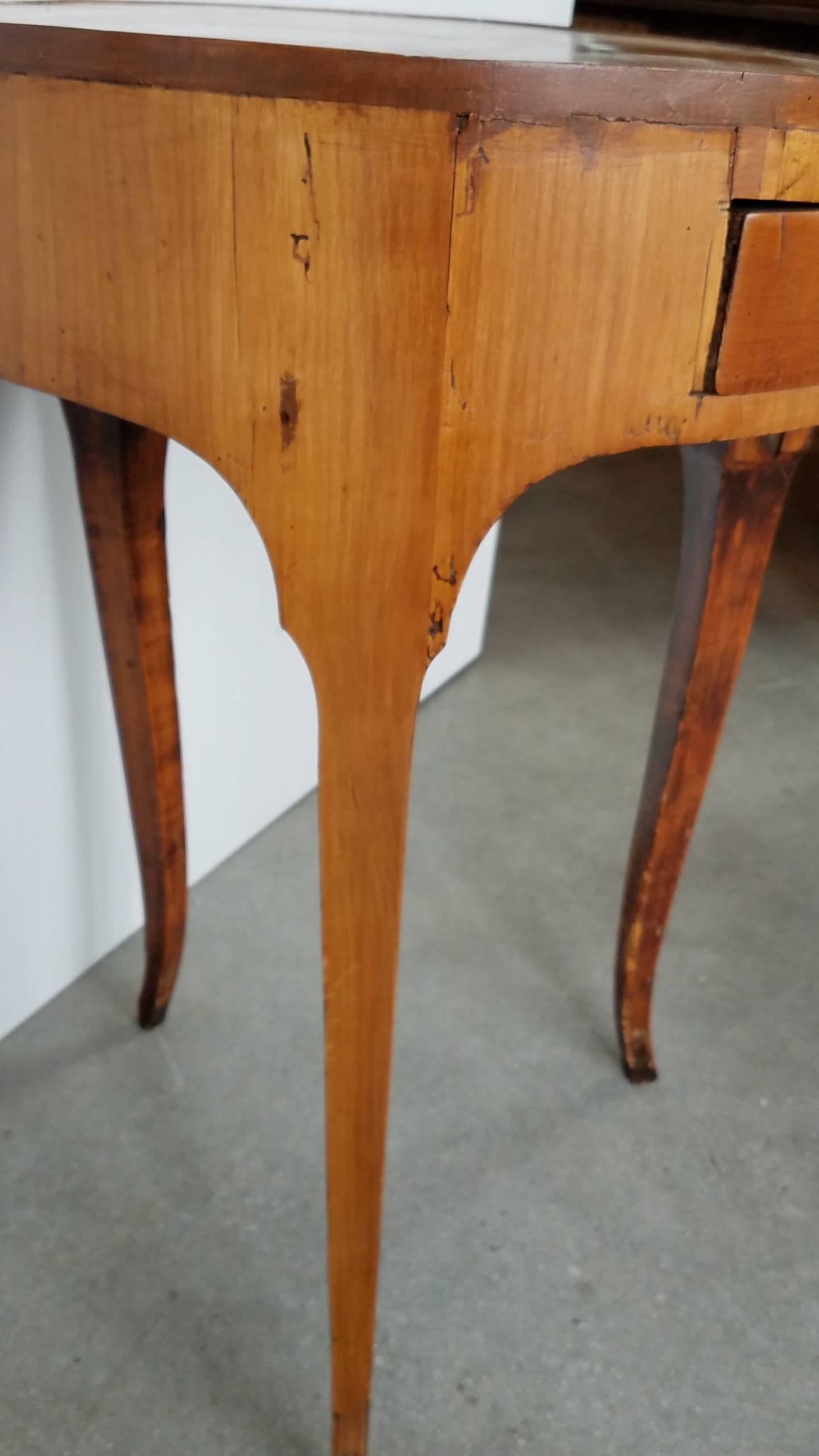 This antique French side table has the most deftly crafted top resembling a tree trunk section with its slices of inlay fanned out in a circle and tacked with tiny tack nails. The color is less red than in many of the photos and is in good