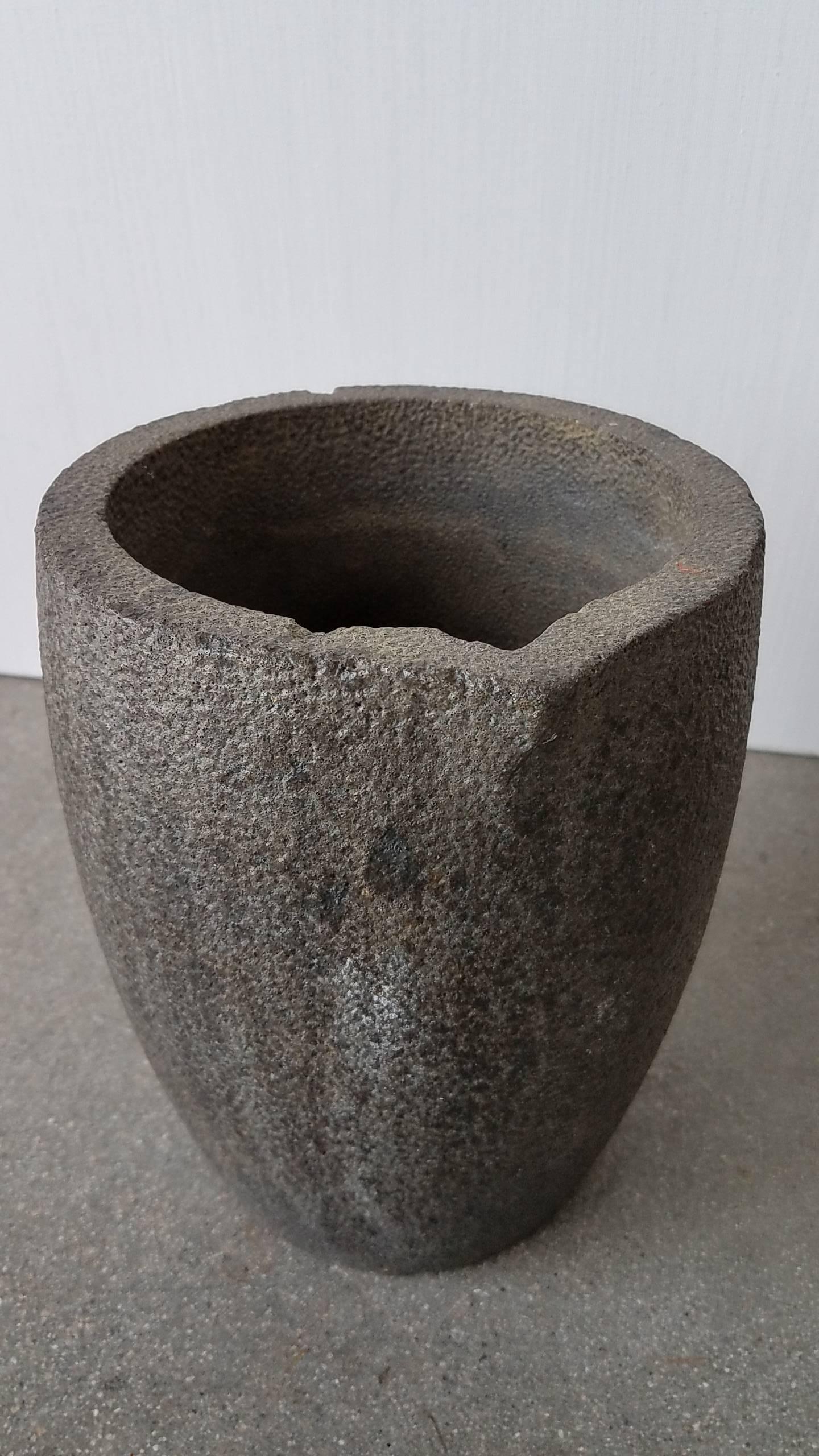 Foundry pot in perfect condition and would make a great vase for the garden.  Heavy iron with wonderful clean texture.