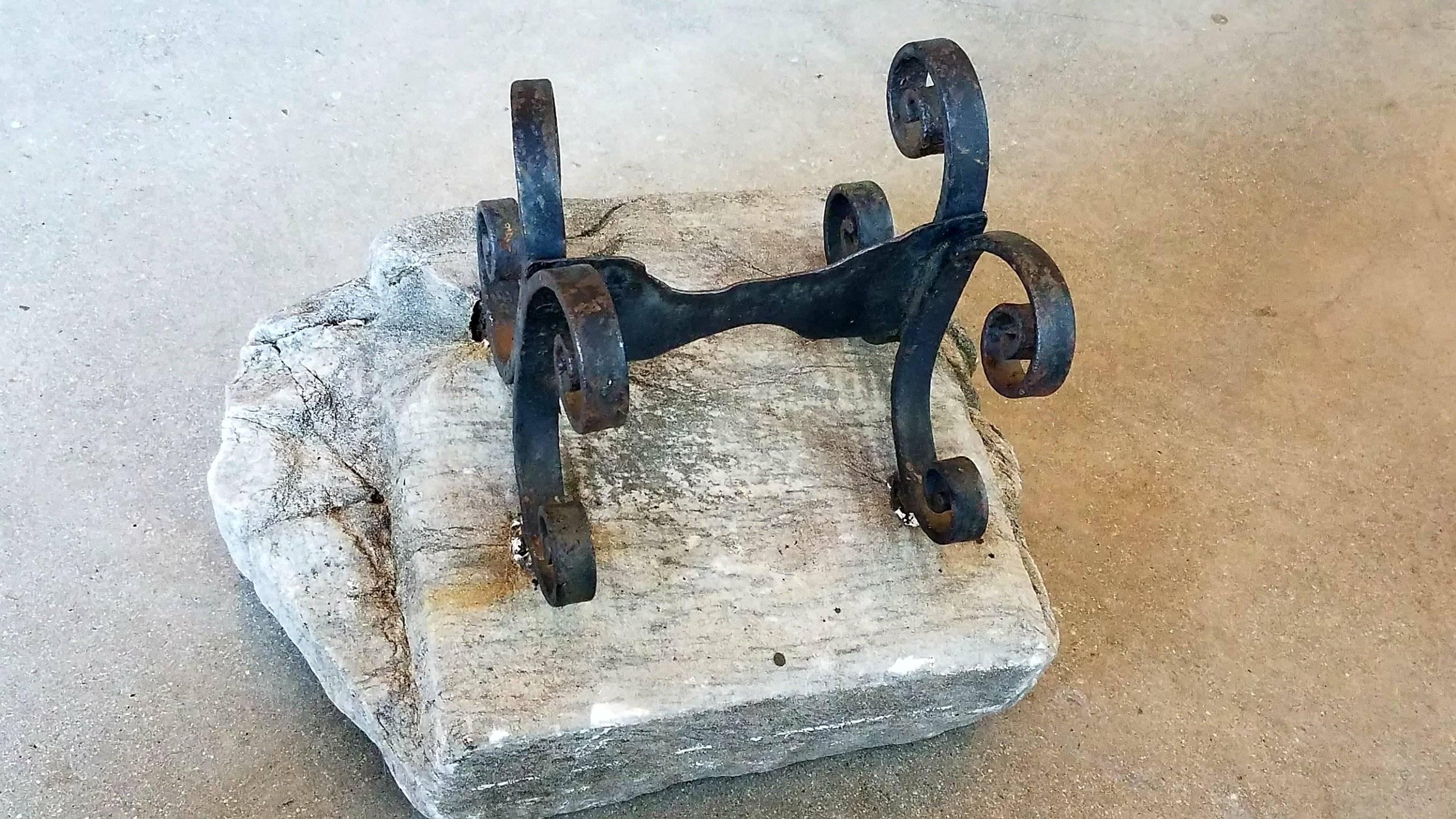 Using this antique boot scrape on a table for drama and effect in a vignette is the way of using it to it's fullest. The ancient stone it is mounted on has amazing character and presence.