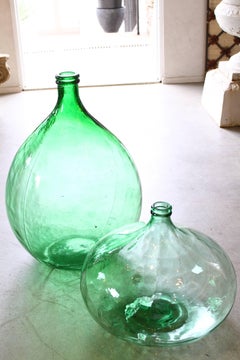 Pair of Italian Green Glass Demijohns