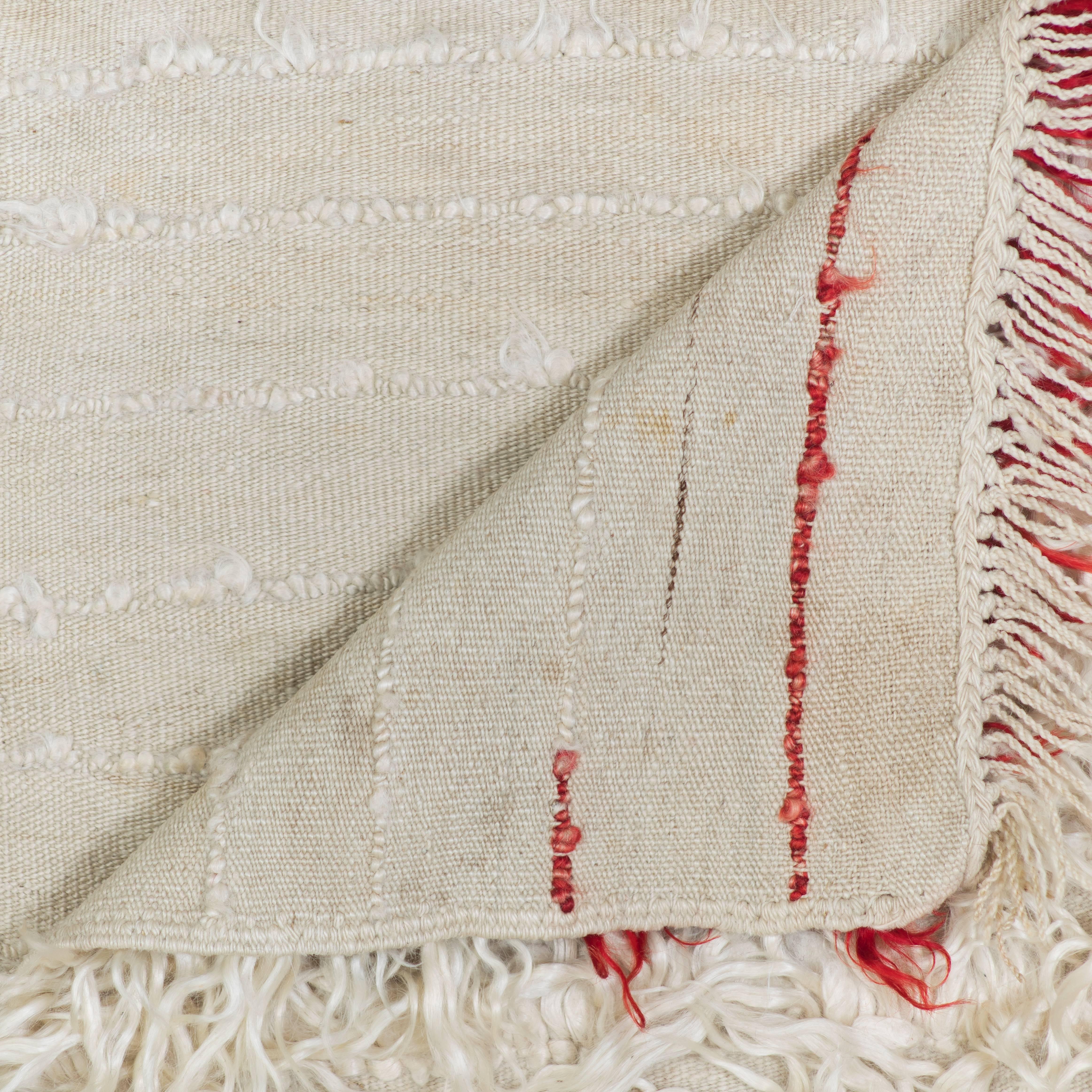 A Filikli's silky pile is handwoven from longhaired goat’s wool.

* This vintage rug has its own distinctions and imperfections. Minor wear, flaws and discolorations may be expected, consistent with the age and use of a vintage textile. All sales