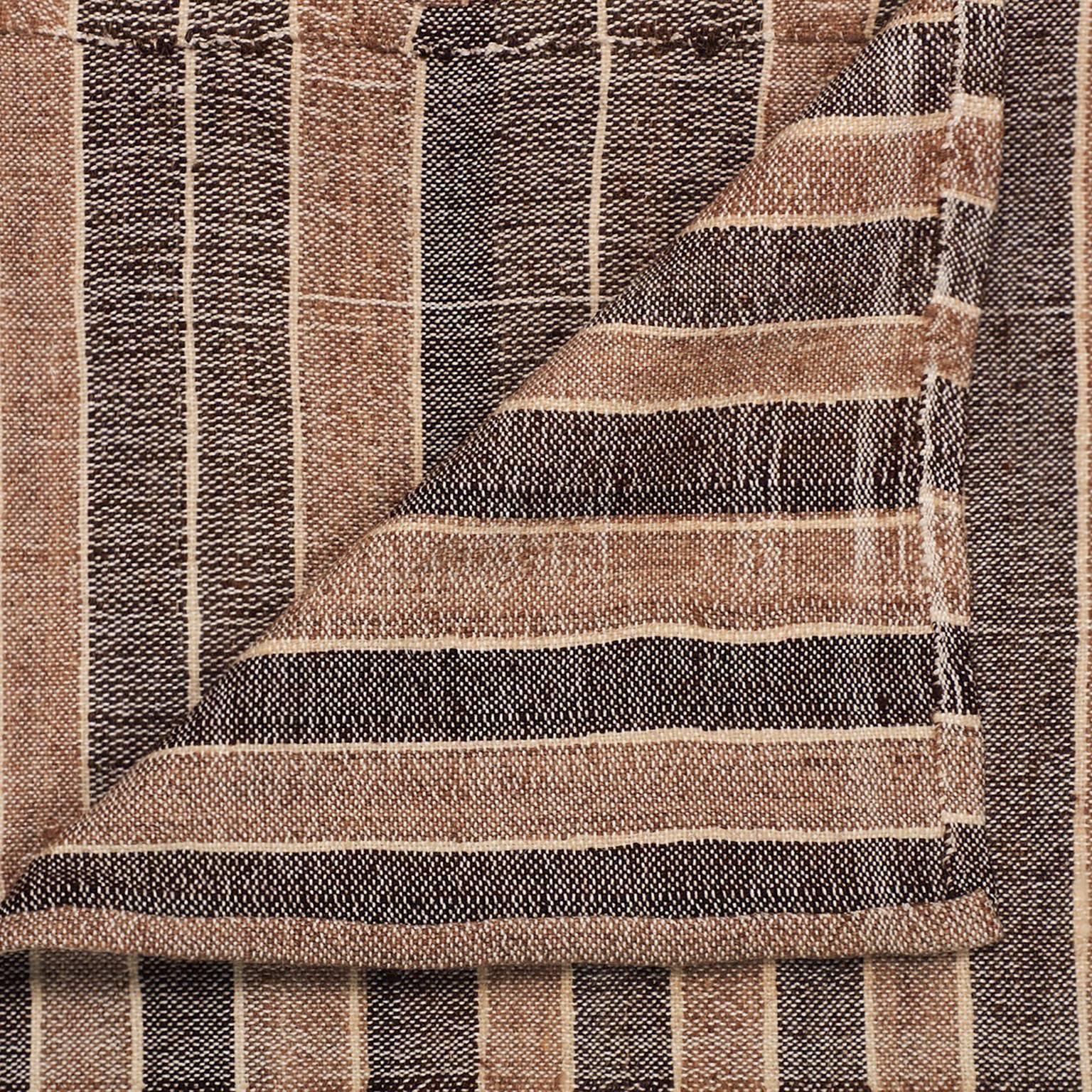 Individually woven panels in contrasting stripes are hand-stitched together to create an unexpected and large-scale composition.

This vintage rug has its own distinctions and imperfections. Minor wear, flaws and discolorations may be expected,