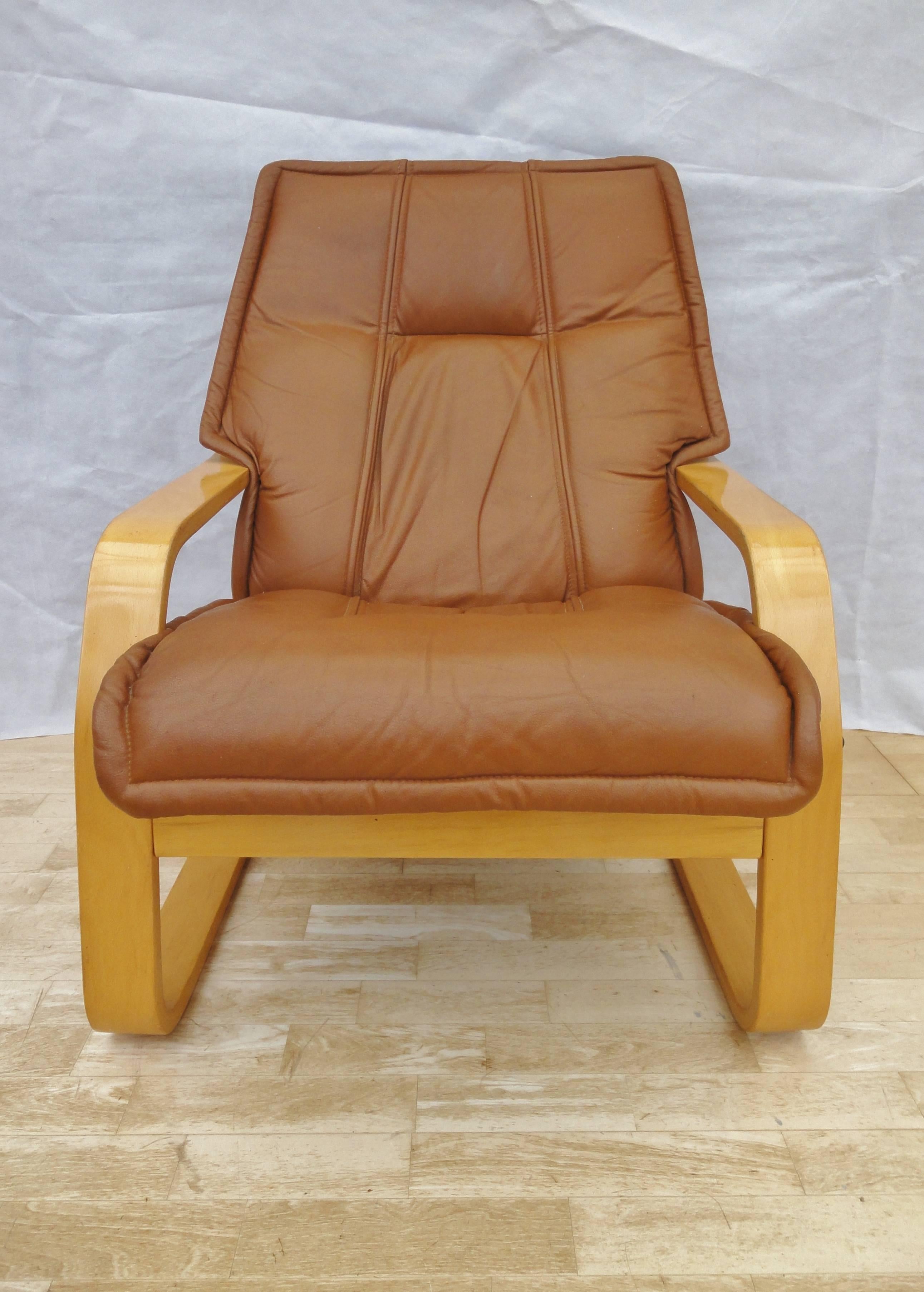 Designer: Danish Design

Manufacturer: Verikon

Country: Denmark

Date: 1960s

Material: Tan Leather and Beech wood

Maximum Dimensions: 69cm wide, 85cm deep, and 90cm tall.
Seat Height to the front 45cm.

Condition: