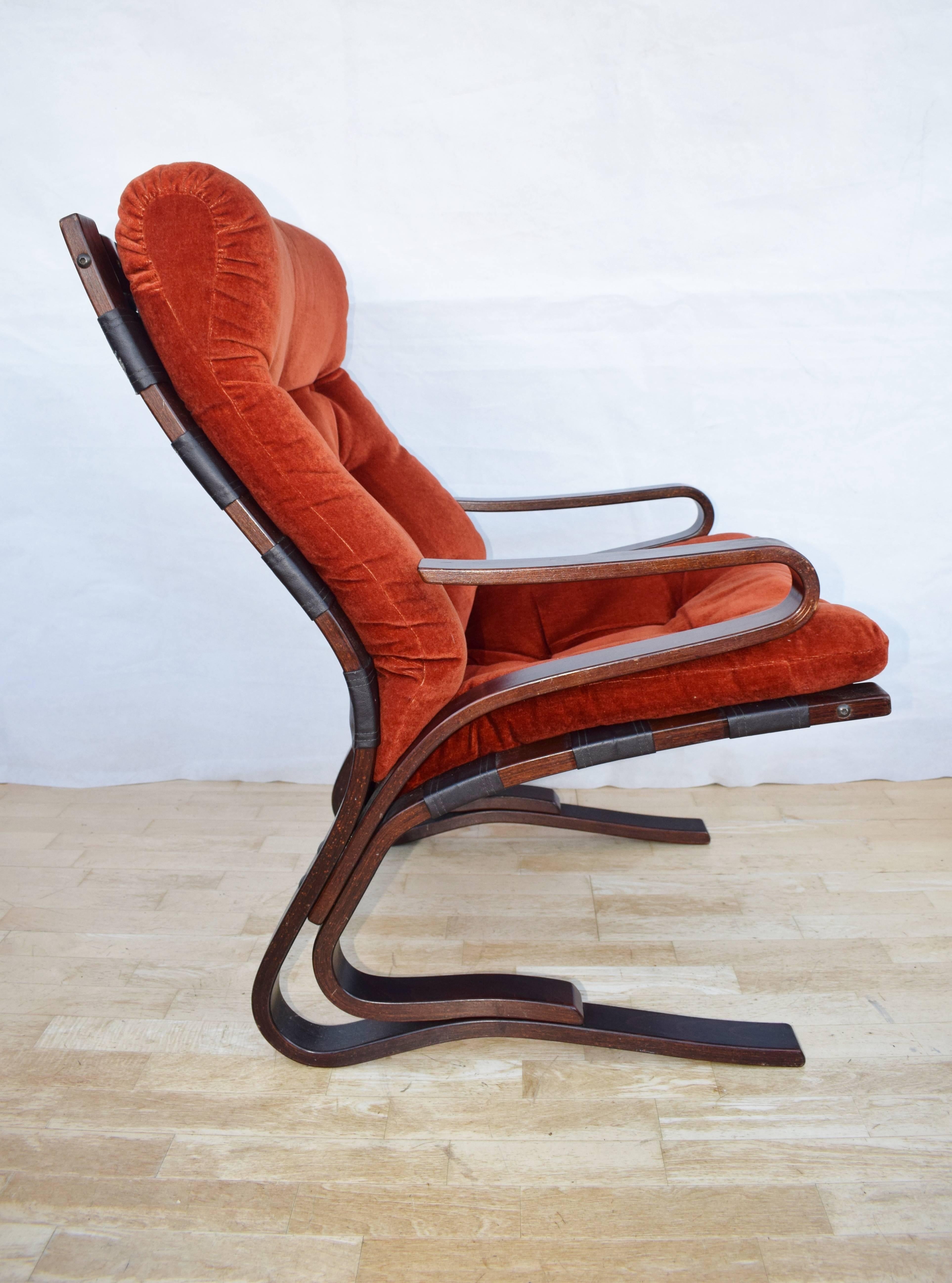 Designer: Norwegian Design.

Manufacturer: Westnofa.

Country: Norway.

Date: 1960s.

Material: Red Draylon upholstery with beech frame.

Maximum Dimensions: Width 66cm, depth 80cm, height 93cm and seat height 46cm.

Condition: Excellent