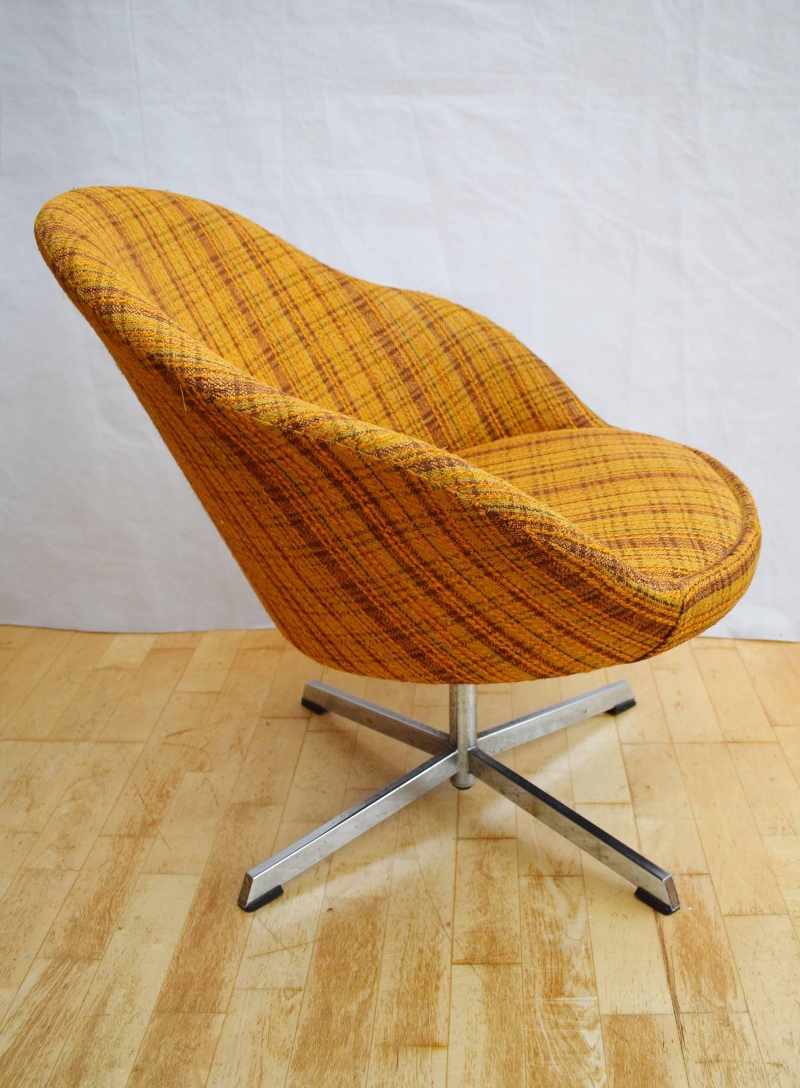Designer: Danish design

Manufacturer: Unknown

Country: Denmark

Date: 1960s

Material: Chrome metal frame with swivel base and patterned wool upholstery

Maximum dimensions: Width 77cm, depth 70cm, height 69cm and seat height