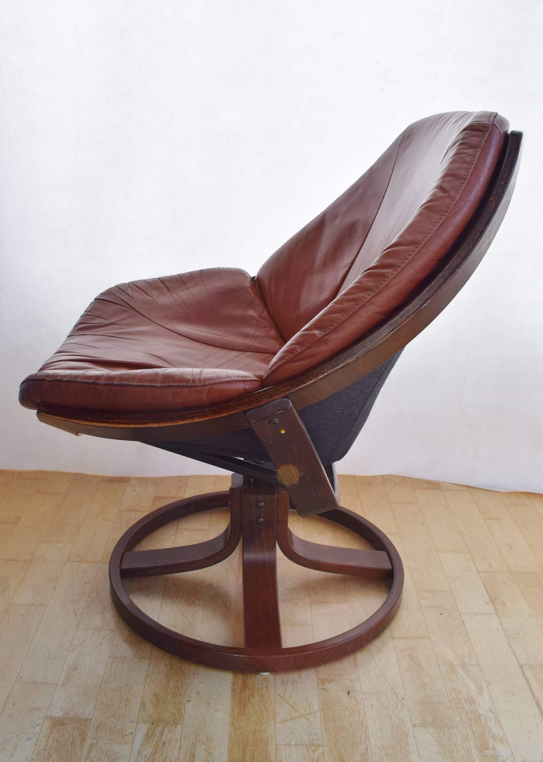 Designer: Danish design

Manufacturer: Unknown

Country: Denmark

Date: 1960s

Material: Leather and stained beech frame

Maximum dimensions: 75cm wide , 66cm deep and 86cm tall.
Seat height 44cm .

Condition: Signs of wear to seat base