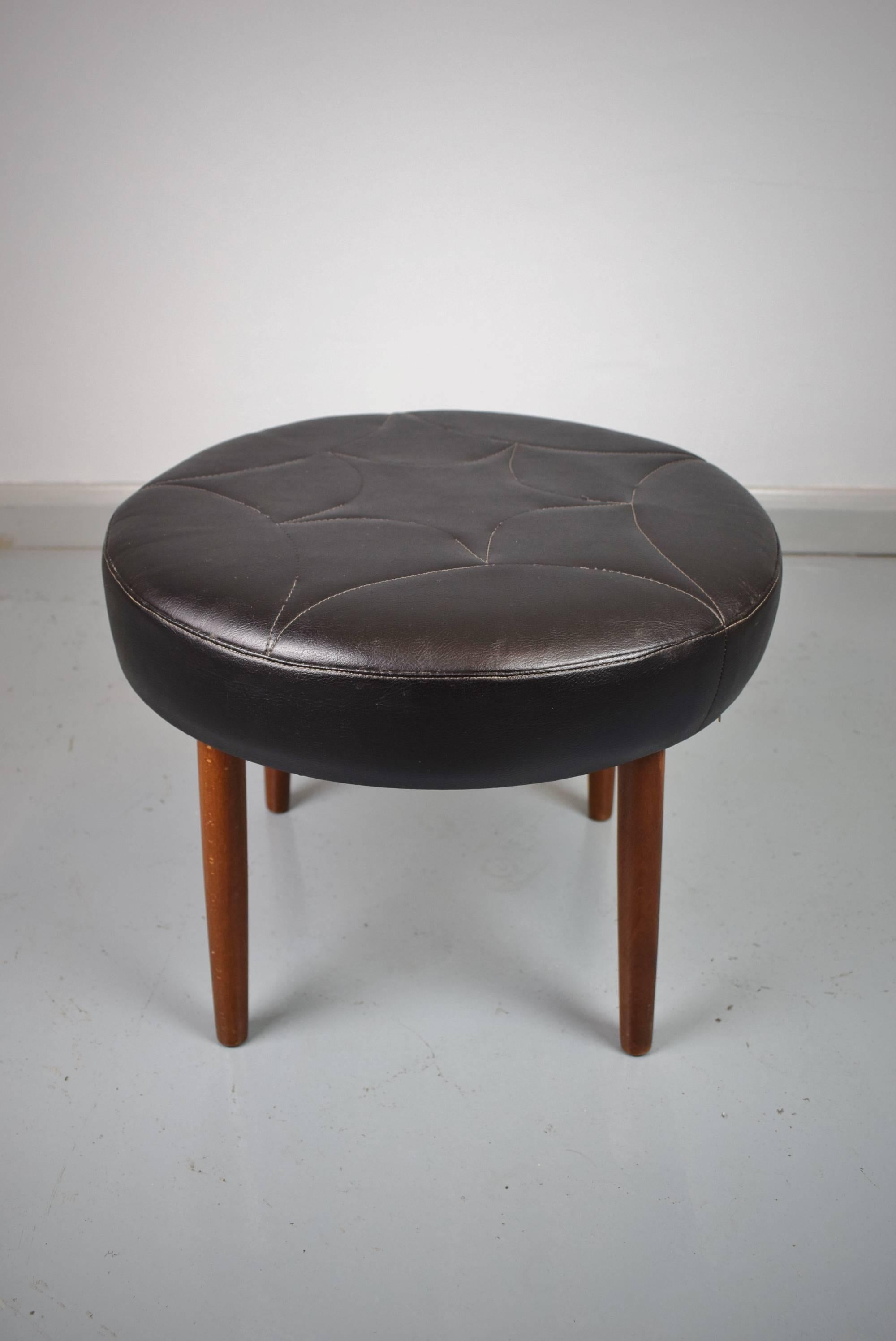 Designer: Danish Design

Manufacturer: Unknown

Country: Denmark

Date: 1960s

Material: Beech frame and legs with black leather upholstery

Maximum dimensions: Diameter 48cm and height 38cm

Condition: In excellent condition with only