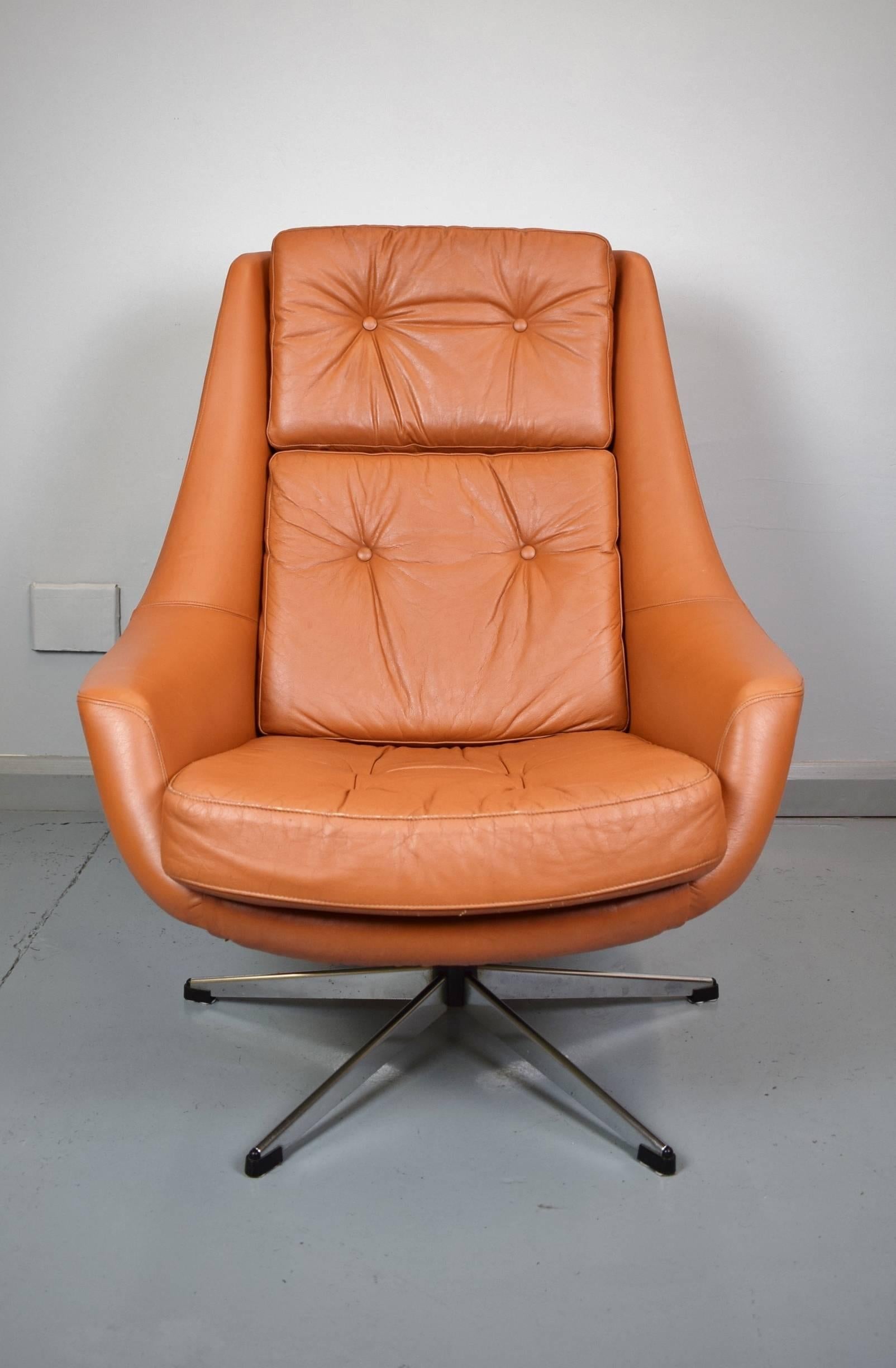 Designer: Henry Walter Klein

Manufacturer: Bramin Mobler

Country: Denmark

Date: 1970s

Material: Tan leather with metal swivel base

Maximum dimensions: Width 79cm, depth 95cm, height 96cm and seat height 40cm

Condition: Excellent