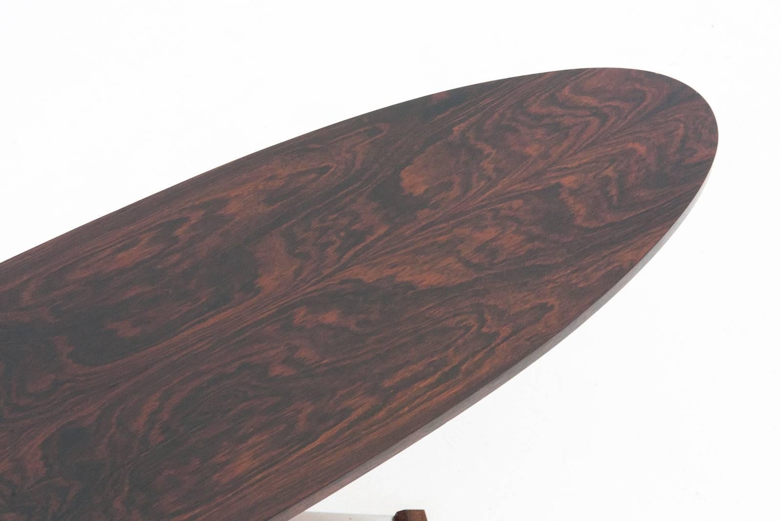 A long and low table manufactured in Italy in 1960s
Iron and rosewood frame , rosewood oval plane 
Completely restored