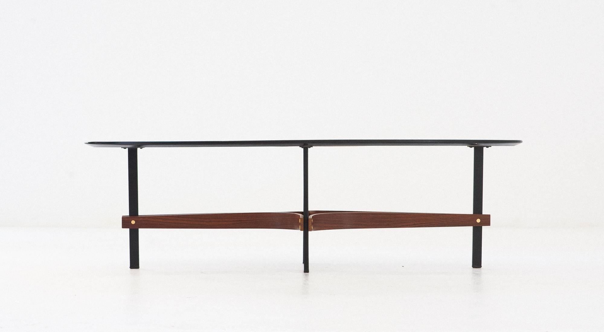 Italian coffee table,
circa 1950
Black lacquered plane, iron, rosewood and brass legs
Completely restored.