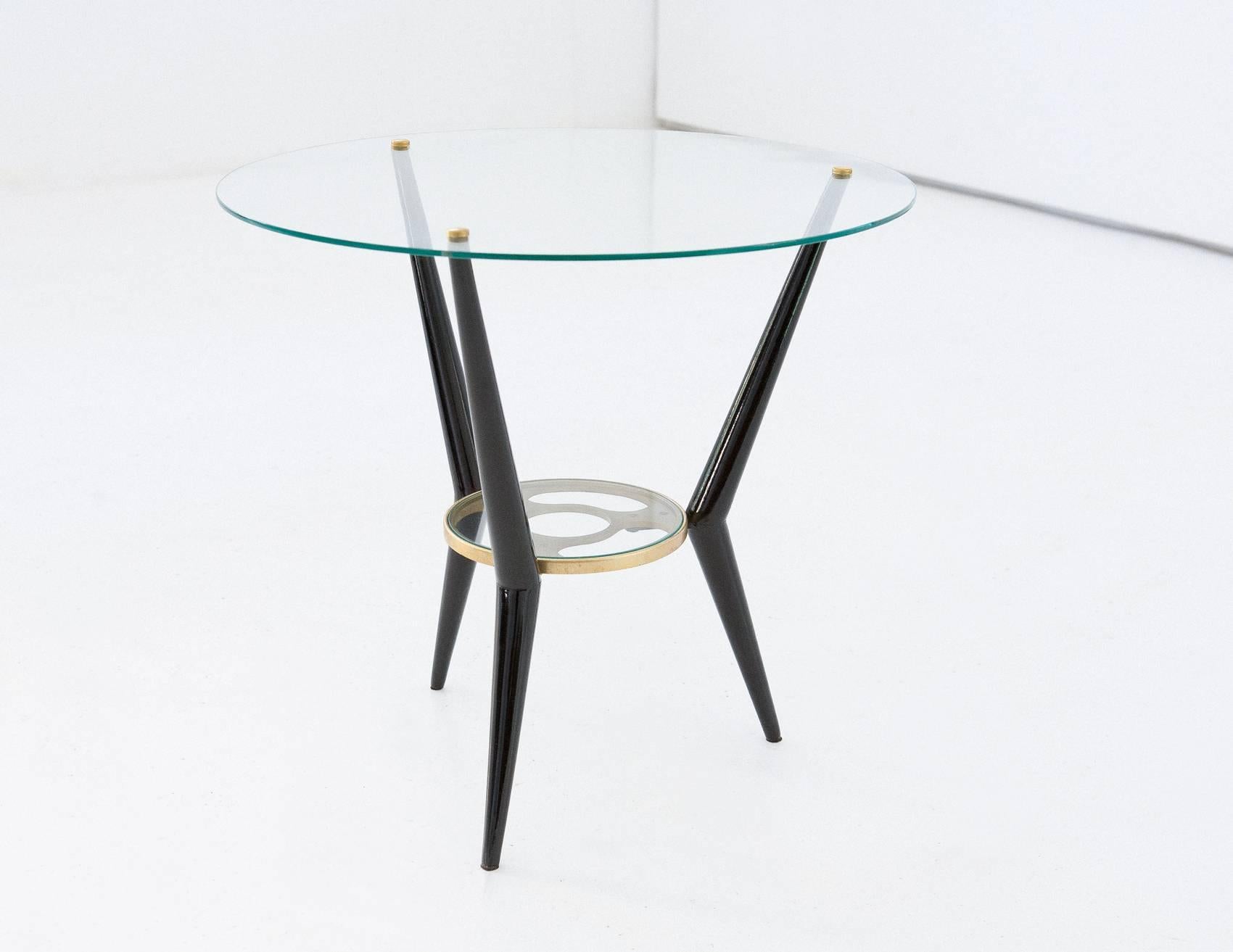 Italian modern coffee table 
circa 1950
Laquered wood
Laquered metal
Glass
Brass
Completely restored.