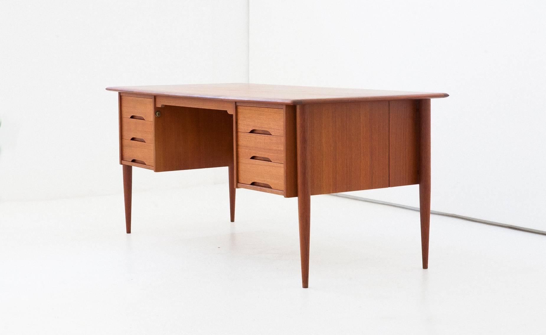 A Danish modern executive desk
teak with little brass details
Completely restored.
  
