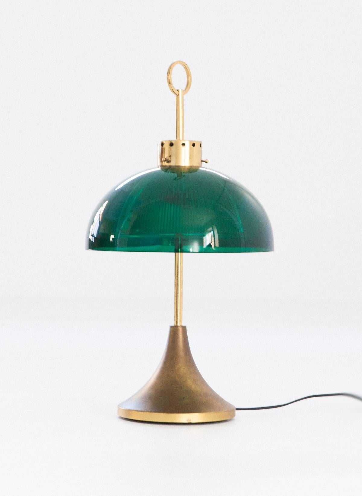 An elegant Italian lamp from the 1950s.
Made of brass with a charming original patina , then a Perspex external shade and glass internal shade.

 