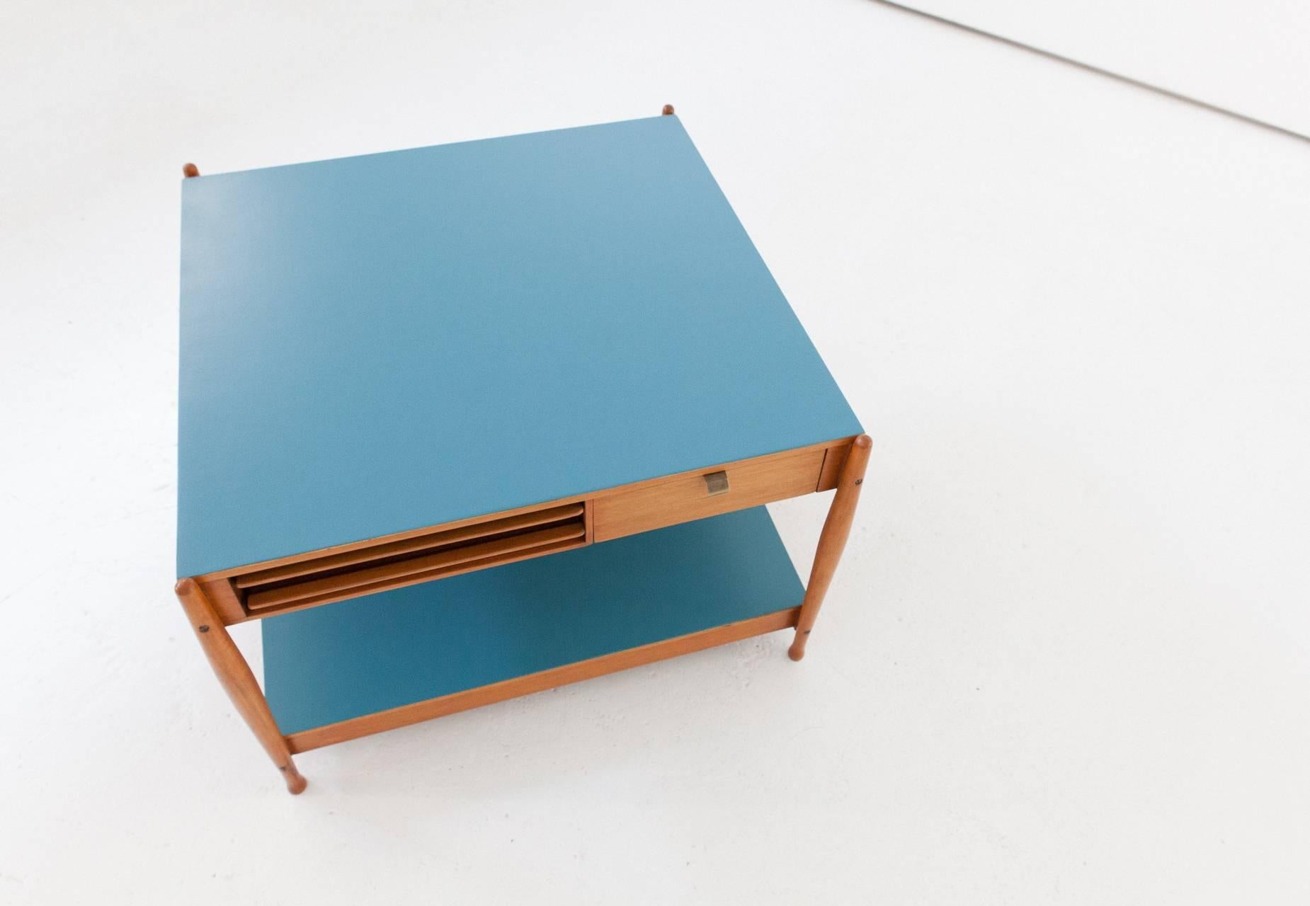 Two level Multifunctional low table by Fratelli Reguitti (Signed)
Light wood and Light blue plains
One drawer and two removable food trays 
Completely restored ,you can only see normal signs of time on the wood

