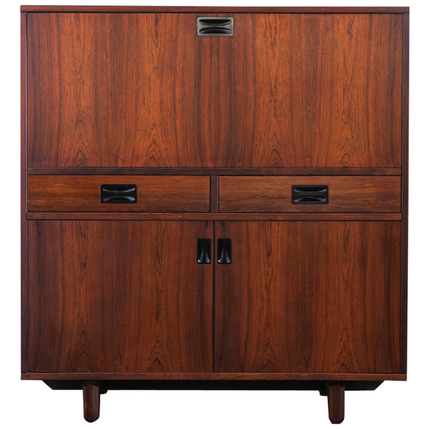 Highboard with bar manufactured in Italy in the 1960s by 'Stildomus'.
                     
The sideboard has a compartment with two hinged doors, two drawers and a large flap door whose inside compartment can be used as a shaker or even as a bar