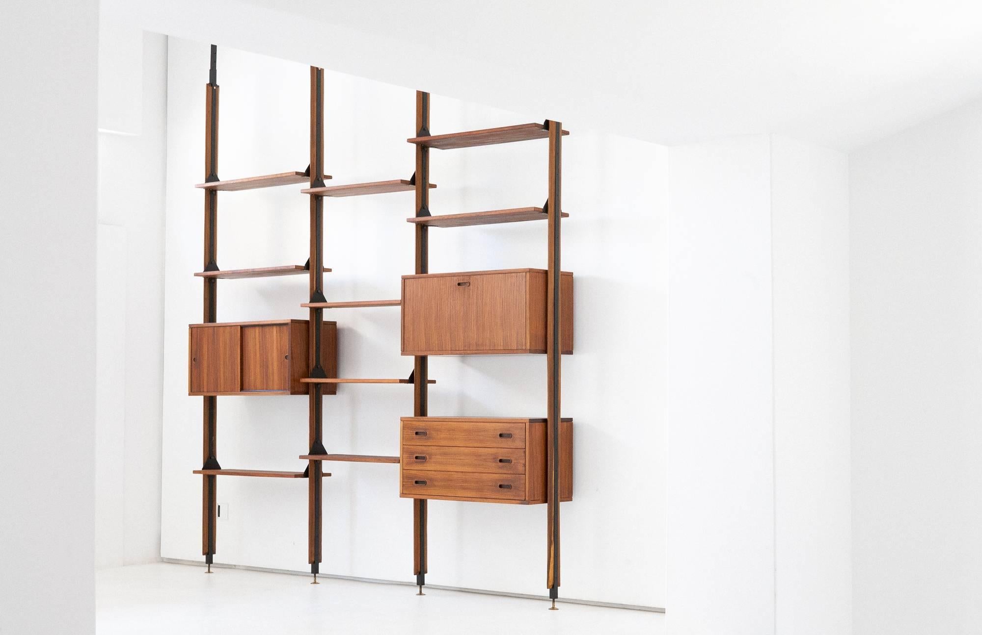 Italian modern wall unit from 1950s
Made of rosewood with lacquered iron and brass parts
Adjustable height 
Completely restored.