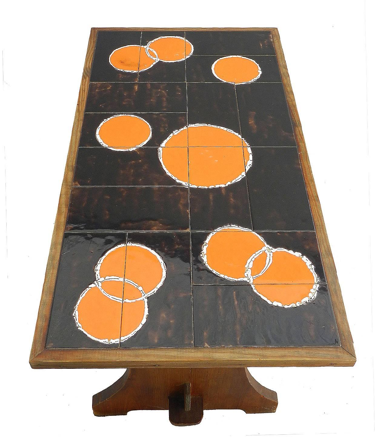 Midcentury Coffee Table Refectory Pine with Tiled Top, circa 1960s 
Orange pop art tiles
Stained Pine base
We offer a global parcel and a door to door freight service as well as 1stdibs delivery service. Please contact us for a non-binding delivery