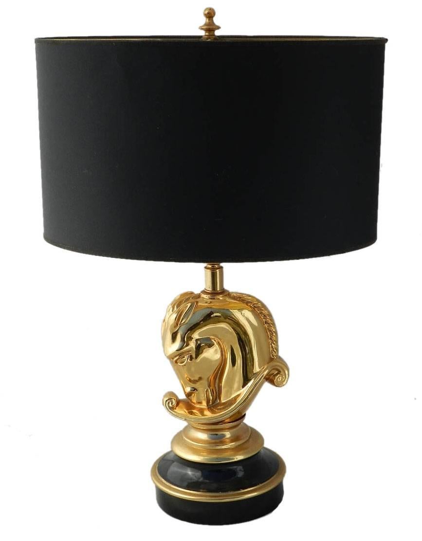 1970s horse head table lamp by Maison Charles.
Classic gold and black metal.
This will be re-wired and tested to USA or UK and European standards ready to install, or for your country please ask.
Shade has ancient world map on one side.
Good
