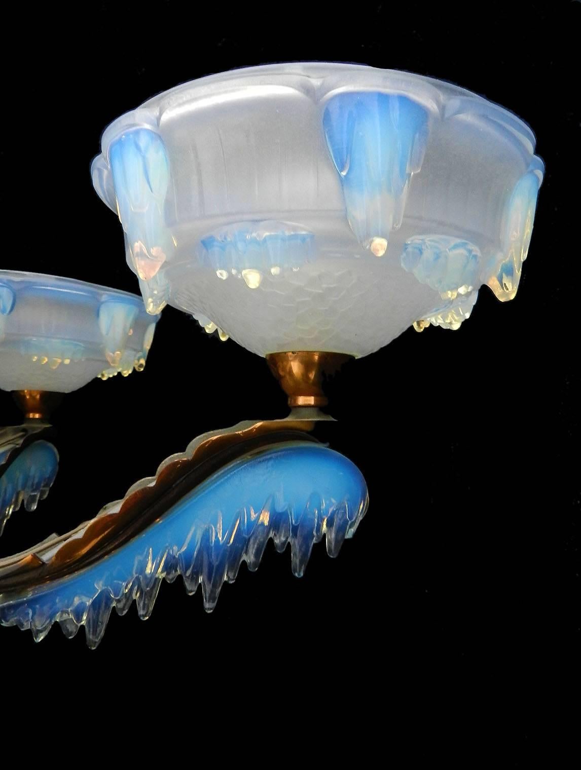 Stunning Art Deco chandelier by Ezan and Petitot
Opalescent glass known as dripping icicles or frozen ice
Glass signed Ezan France
Ezan one of the best French glass makers from the 1930s
Superb original patina to the copper
These will be re-wired