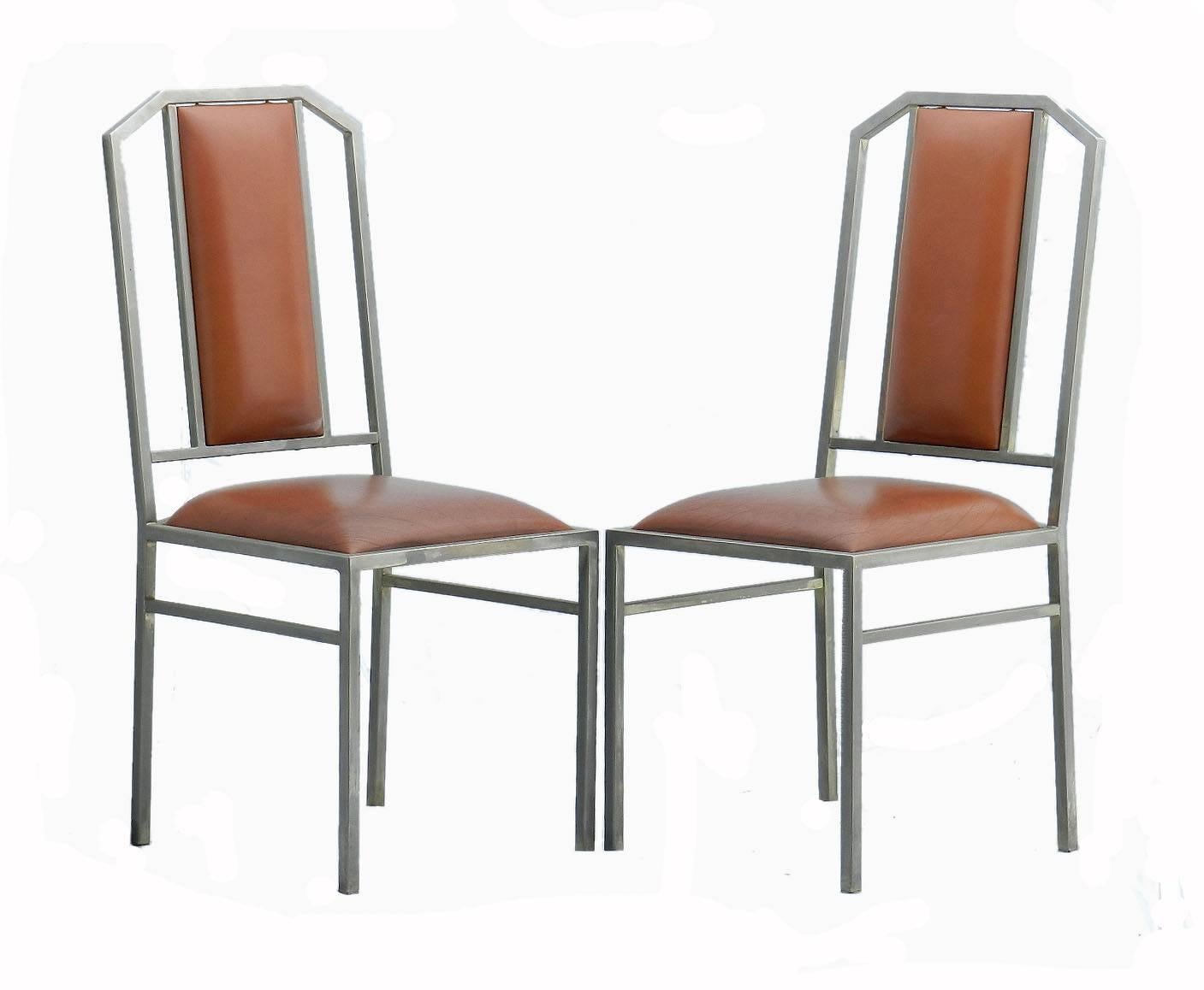 Set of four Maison Jansen dining chairs 
All original with mid tan leather 
Brushed chrome on metal 
Very good condition for their age there are a couple of small losses to the chrome on a couple of the chairs quite normal for their age and use, 